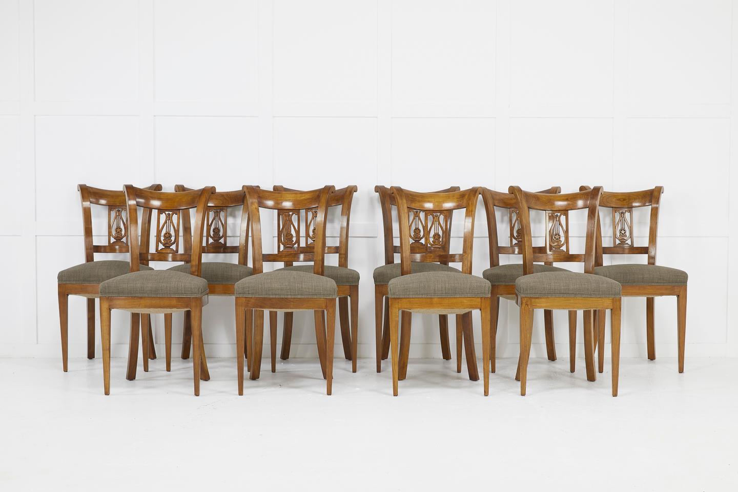 Set of twelve 19th century Austrian cherrywood dining chairs comprising two carvers and ten chairs with lyre back rests.
Difficult to find as a set of twelve these days.

Measures: Seat height 46 cm
Seat depth 51 cm

Chair dimensions:
H 89, W