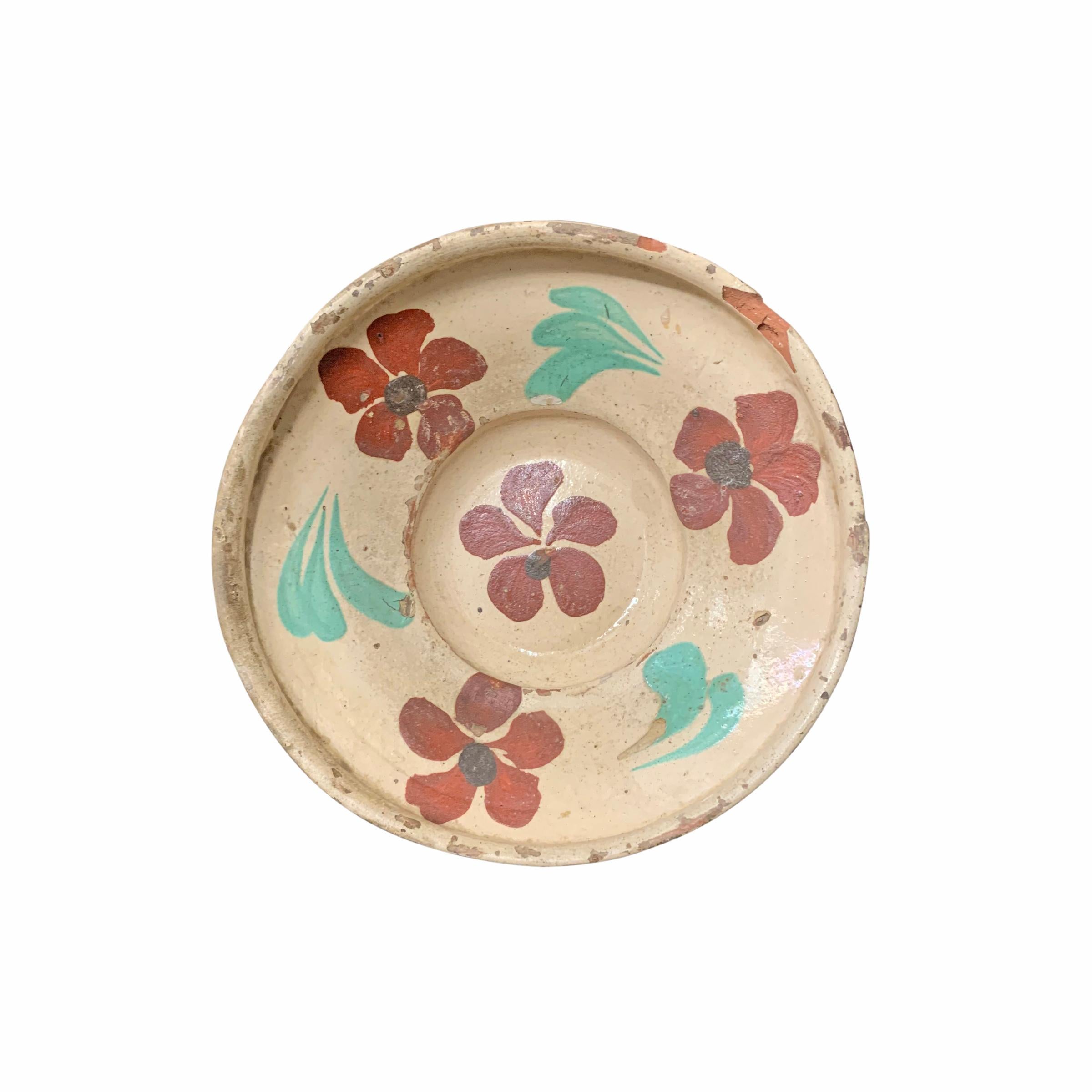 A fantastic and rare set of twelve 19th century Hungarian folk ceramic bowls, each slip glaze painted with unique floral patterns in various colors. Each bowl has the original string on the back which was used to hang the bowl on a wall in the