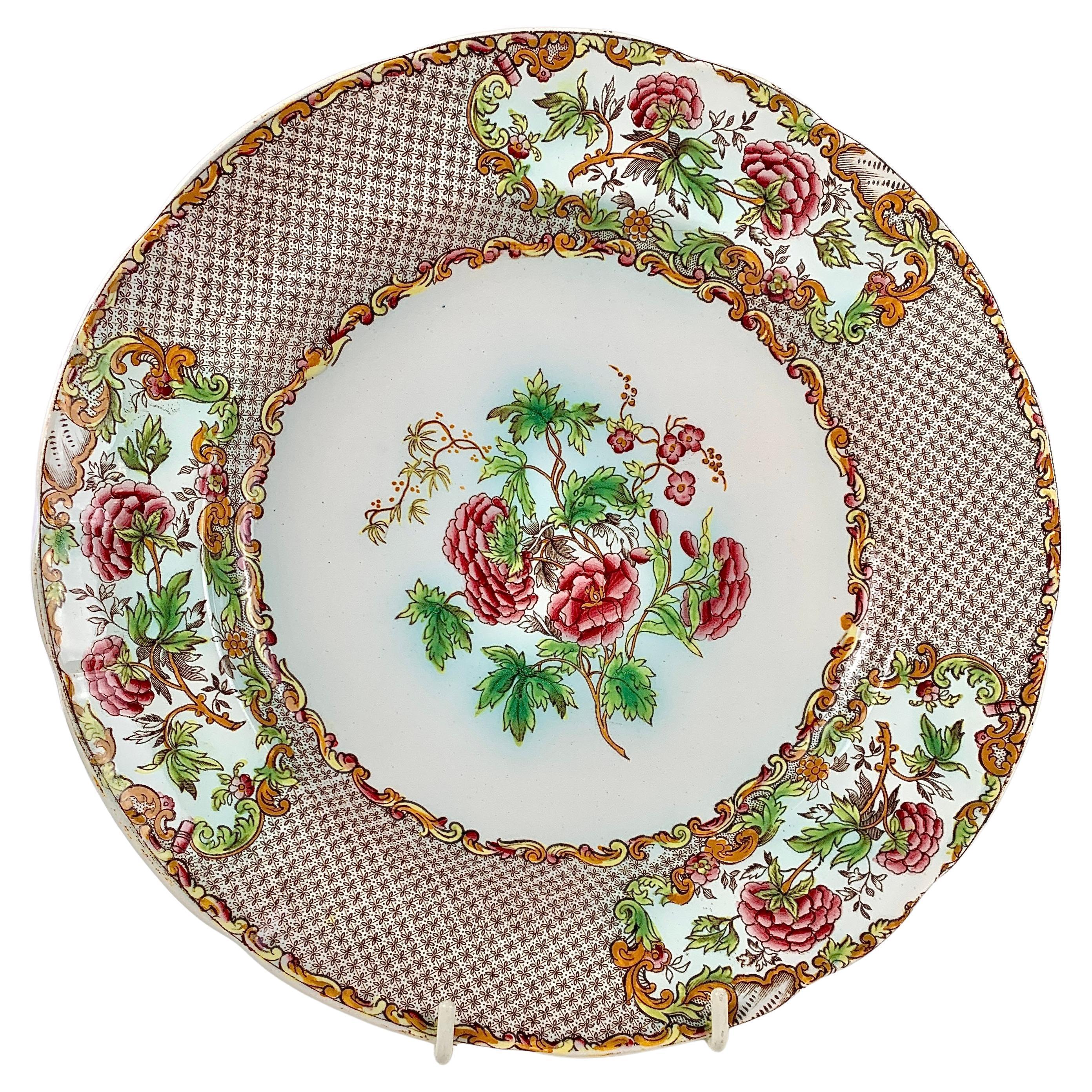 Looking for a set of antique dinner plates that are not only stunning but also hold a piece of history? Spode made this set of twelve dinner plates during the Copeland & Garrett era of 1833-1847. The center of each plate features pink roses and