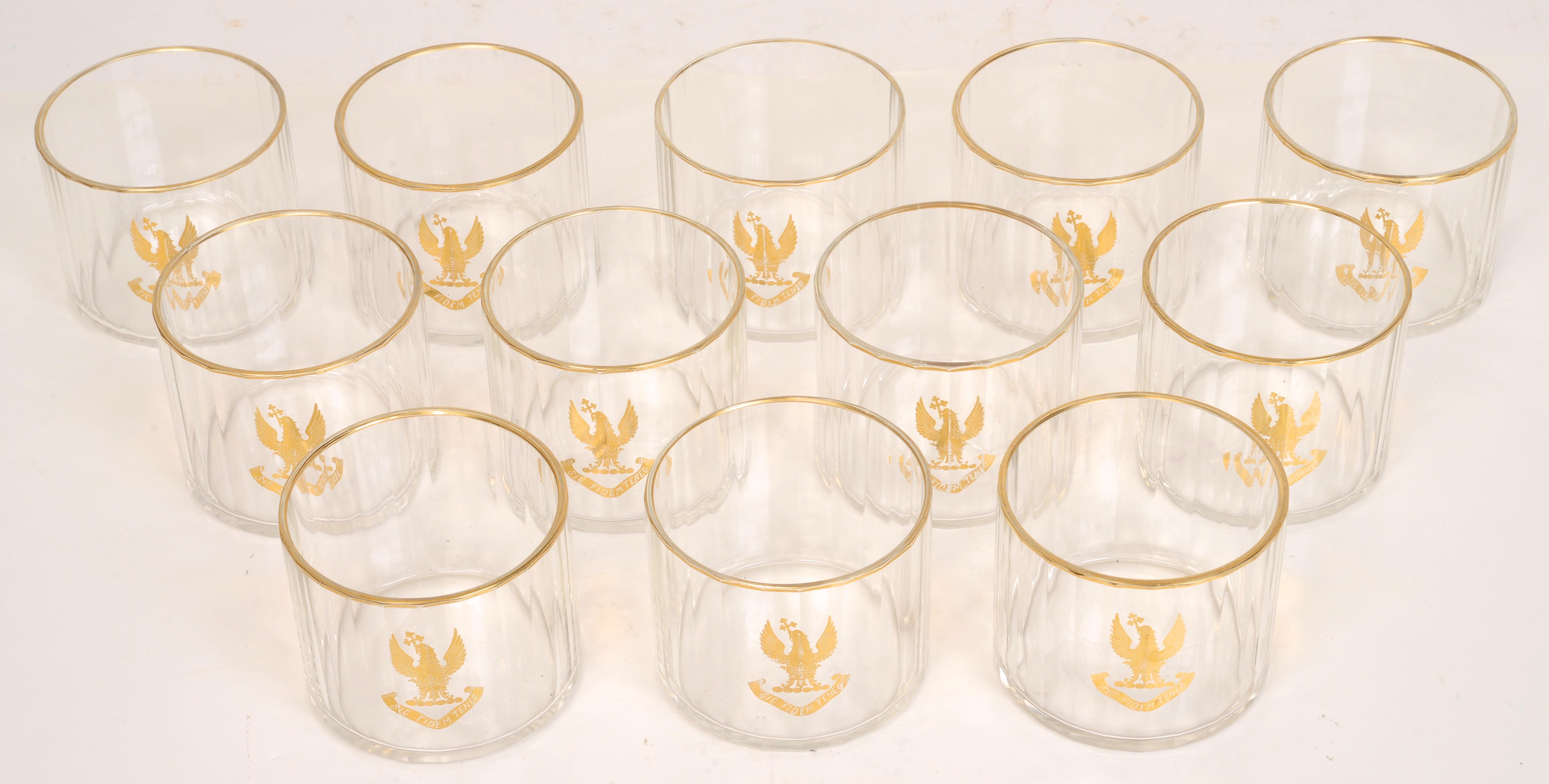 Set of Twelve Armorial, Straight Sided, Gilt Decorated, Face-Cut, 24 Panel Crystal Glasses. These glasses are the standard choice for serving whiskey and old fashioned drinks. They are mouth-blown and have a ground pontil. The gilded rims and