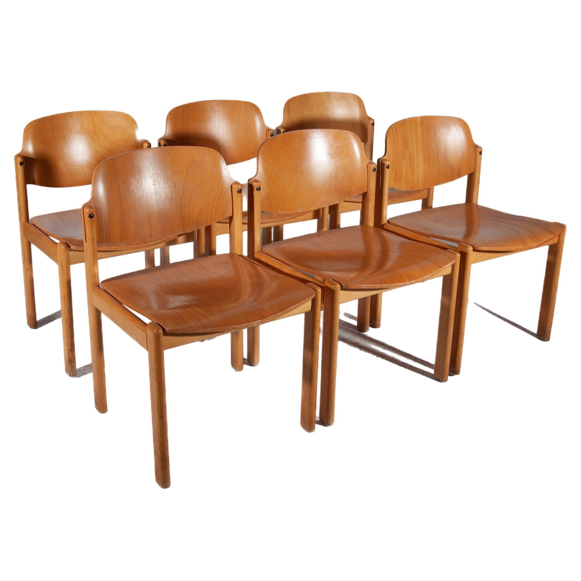 Set of 6 chairs in solid beech and plywood, Germany 1970s. The chairs are solid sturdy chairs, with high seating comfort for wooden chairs. The chairs are well made in a heavy quality, indestructible, durable.Price one item 12 pieces available.