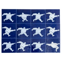 Set of Twelve Blue Vintage Michelin Man Ceramic Tiles, circa 1960
