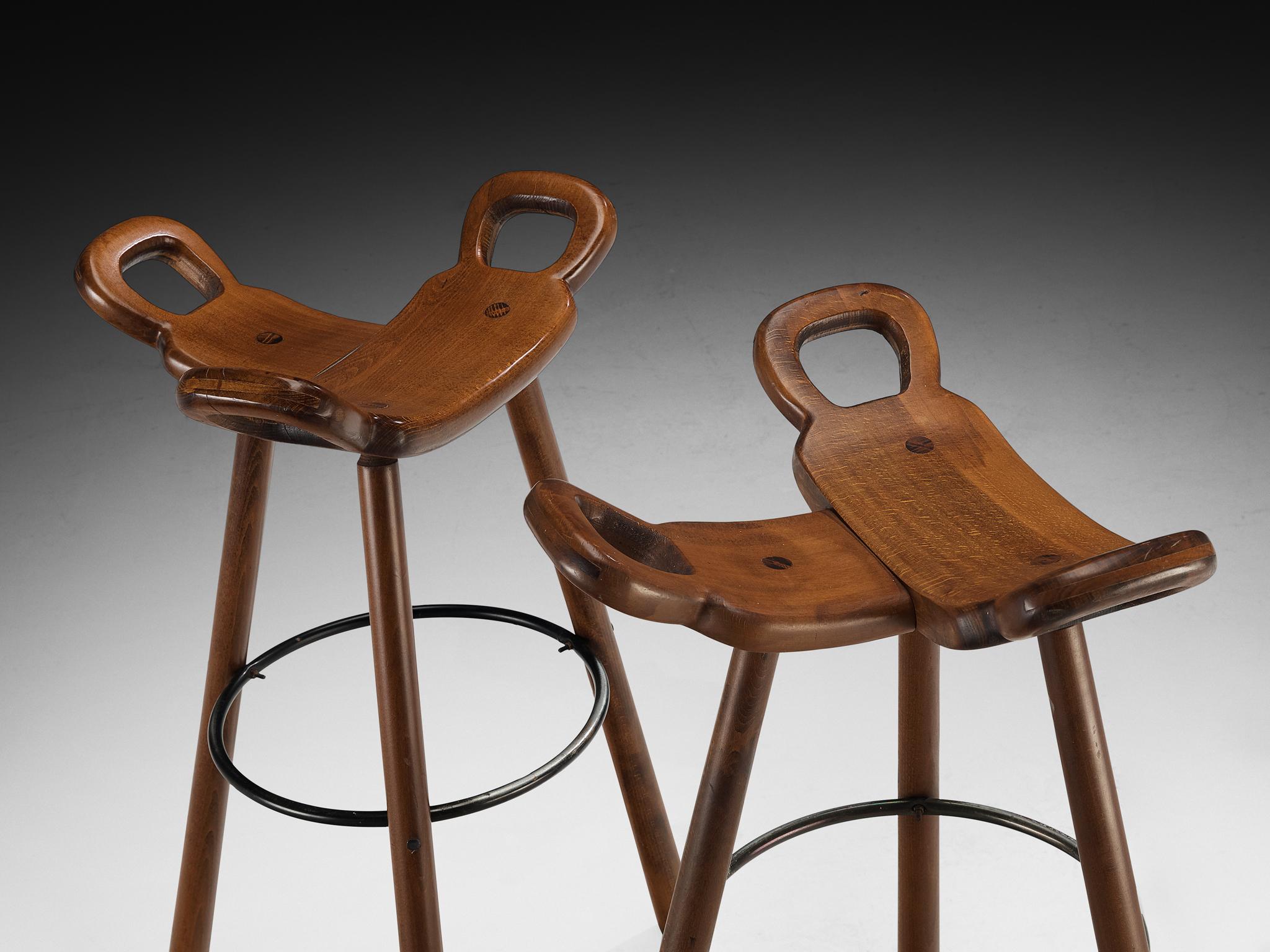 European Set of Twelve Brutalist Bar Stools in Dark Wood For Sale
