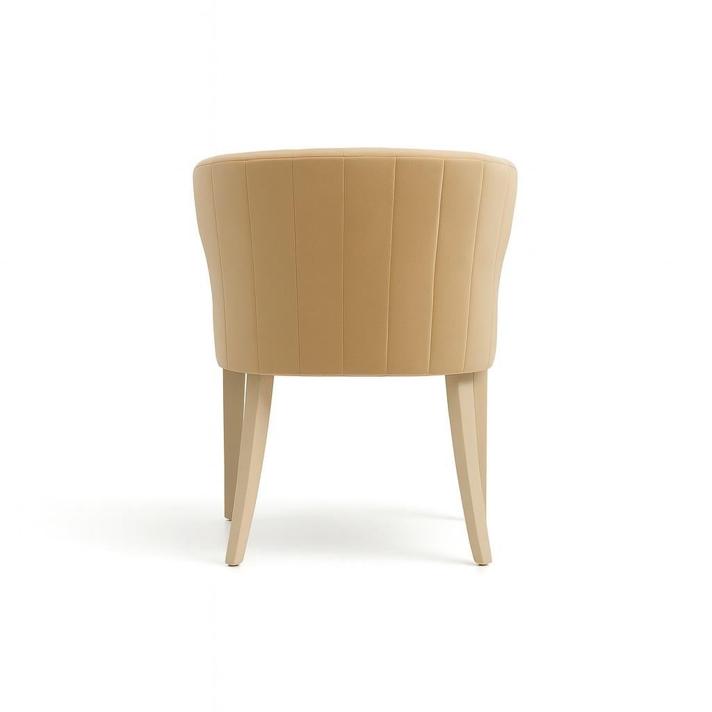 This is a striking and versatile chair. Its curved backrest extends into side projections, giving the piece a unique and personal feel. The soft curves of the backrest contrast with the straight lines of the rest of the chair, creating a balanced