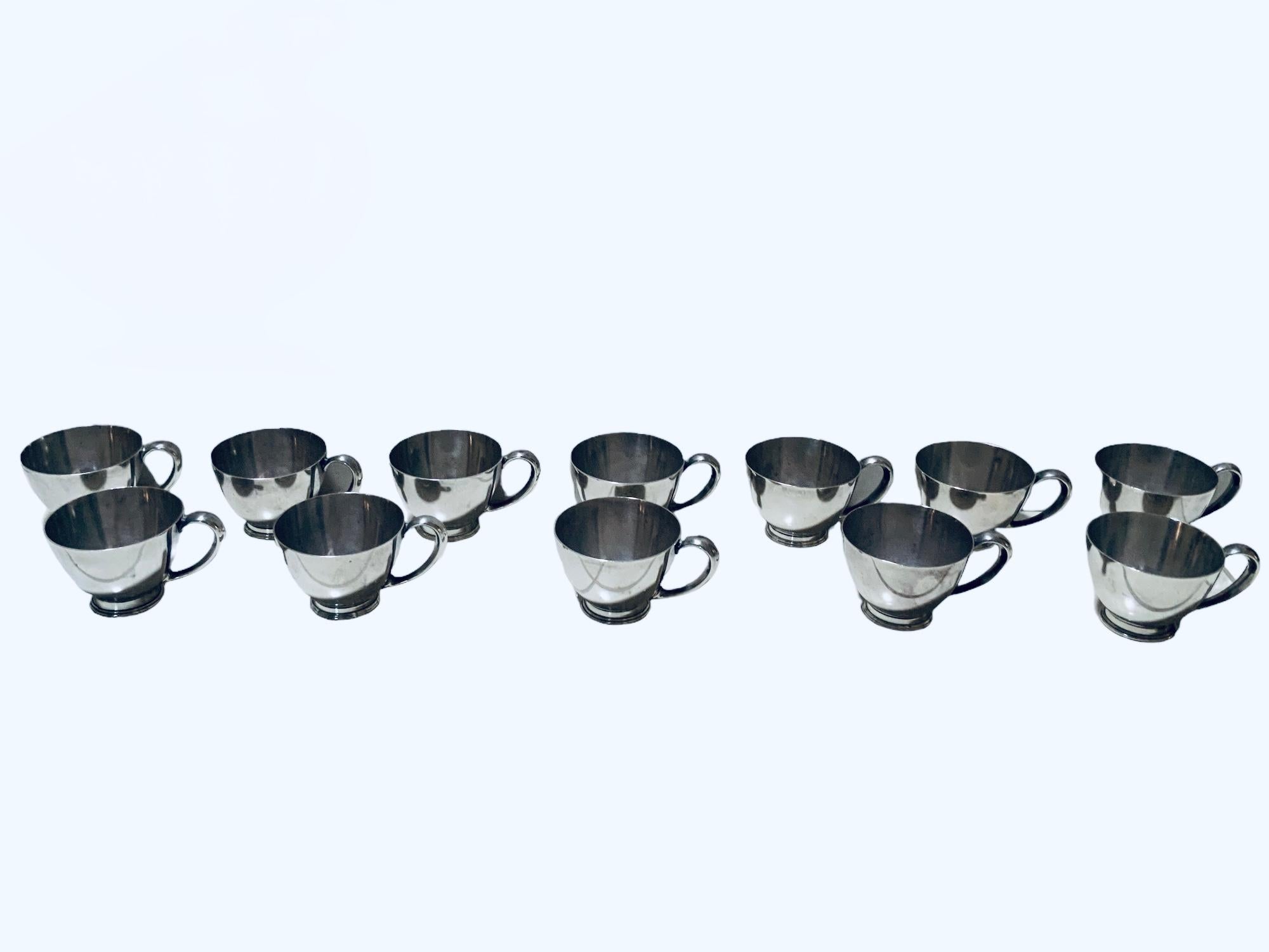 French Set Of Twelve Cartier Sterling Cups For Sale
