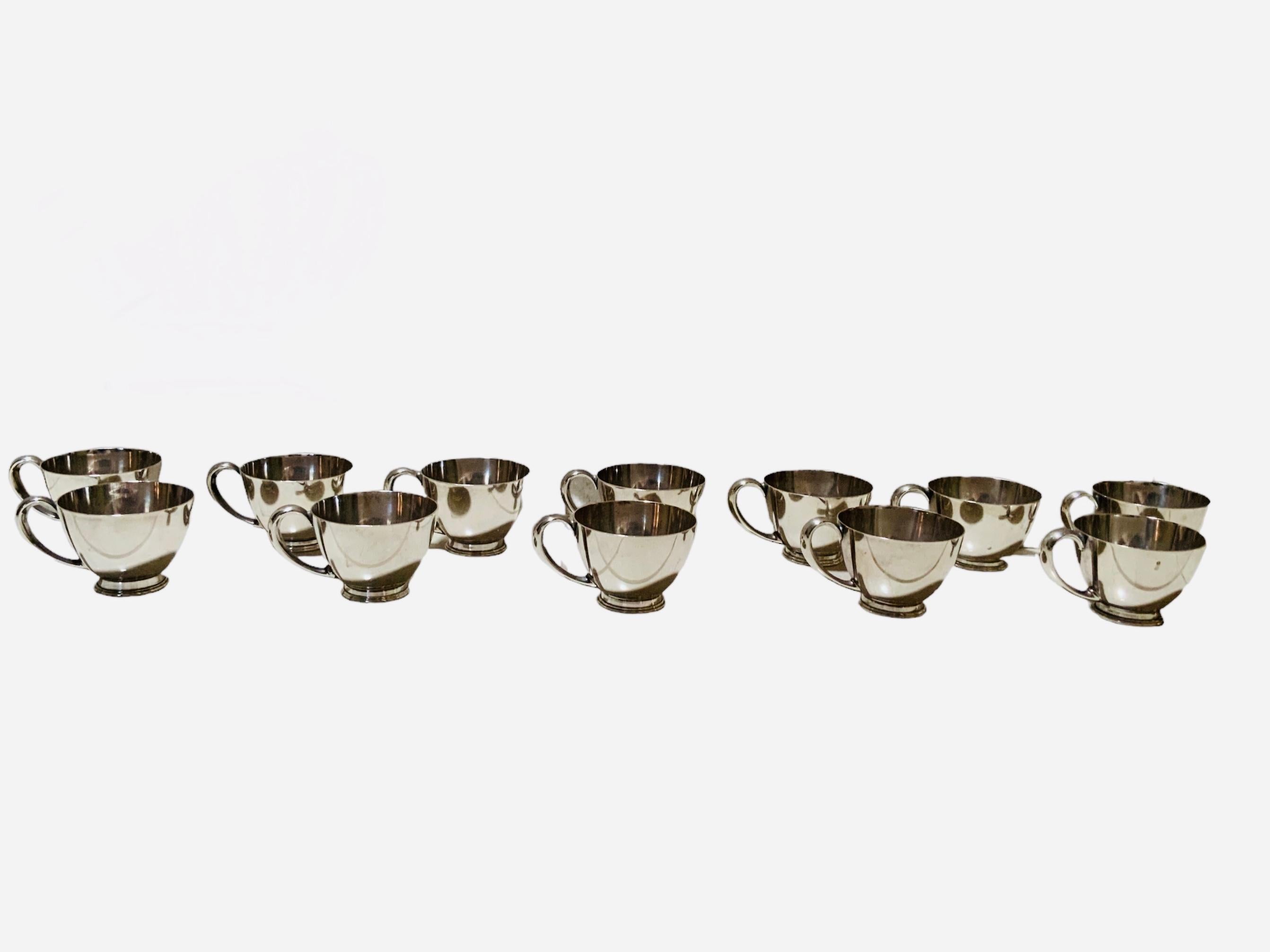 20th Century Set Of Twelve Cartier Sterling Cups For Sale
