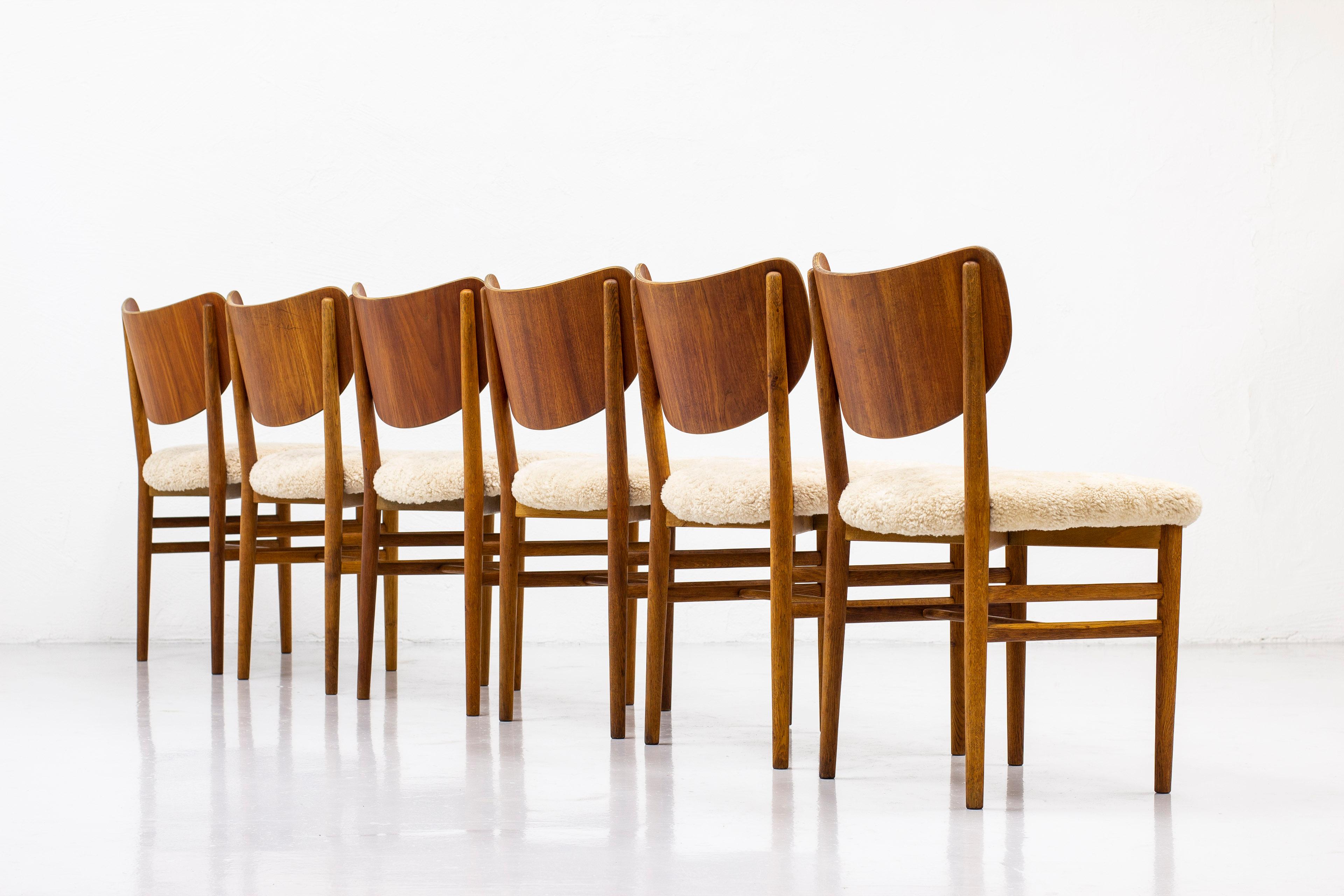 Mid-20th Century Set of Twelve Chairs in Teak and Oak with Sheepskin by Nils & Eva Koppel