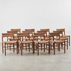 Set of twelve Charlotte Perriand Dordogne Chairs for Robert Sentou, France c1950