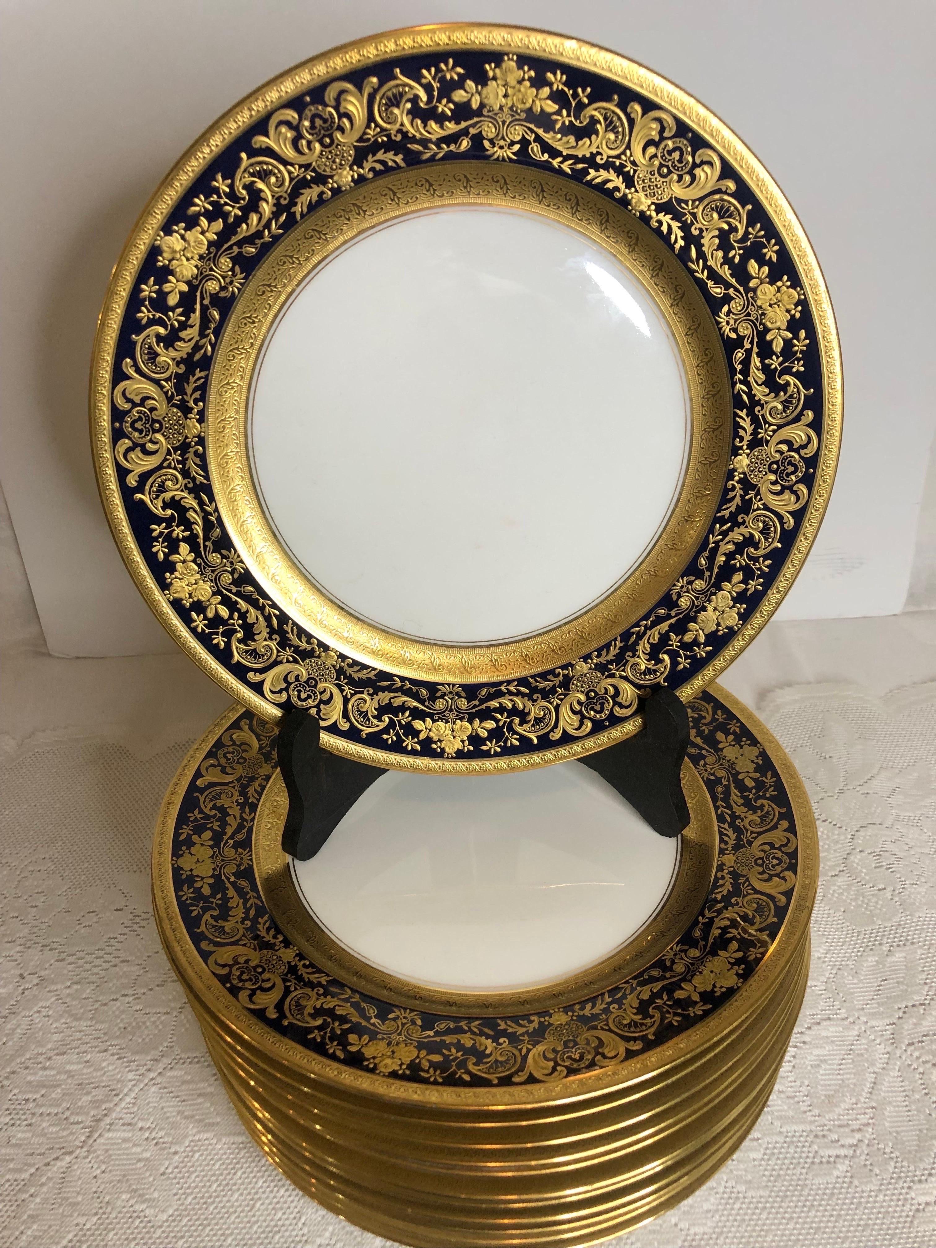 Rococo Set of Twelve Cobalt Rim Limoges Dinner Plates with Profuse Raised Gilding