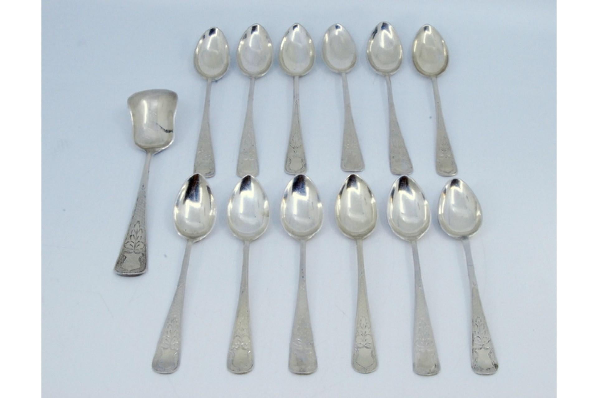 Description: Set of twelve coffee spoons and sugar shovel in brushed and engraved silver. Metal: Silver. Origin: Portuguese. Brand: javali II Title. Weight: 194.33 grams (Set of twelve spoons and shovel). Dimensions: Shovel - 13.5x3cm Spoon -