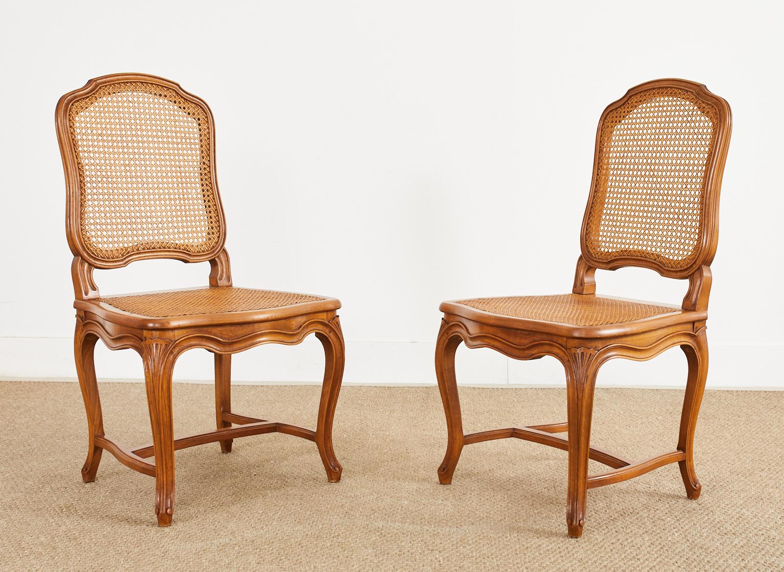 20th Century Set of Twelve Country French Provincial Fruitwood Caned Dining Chairs 