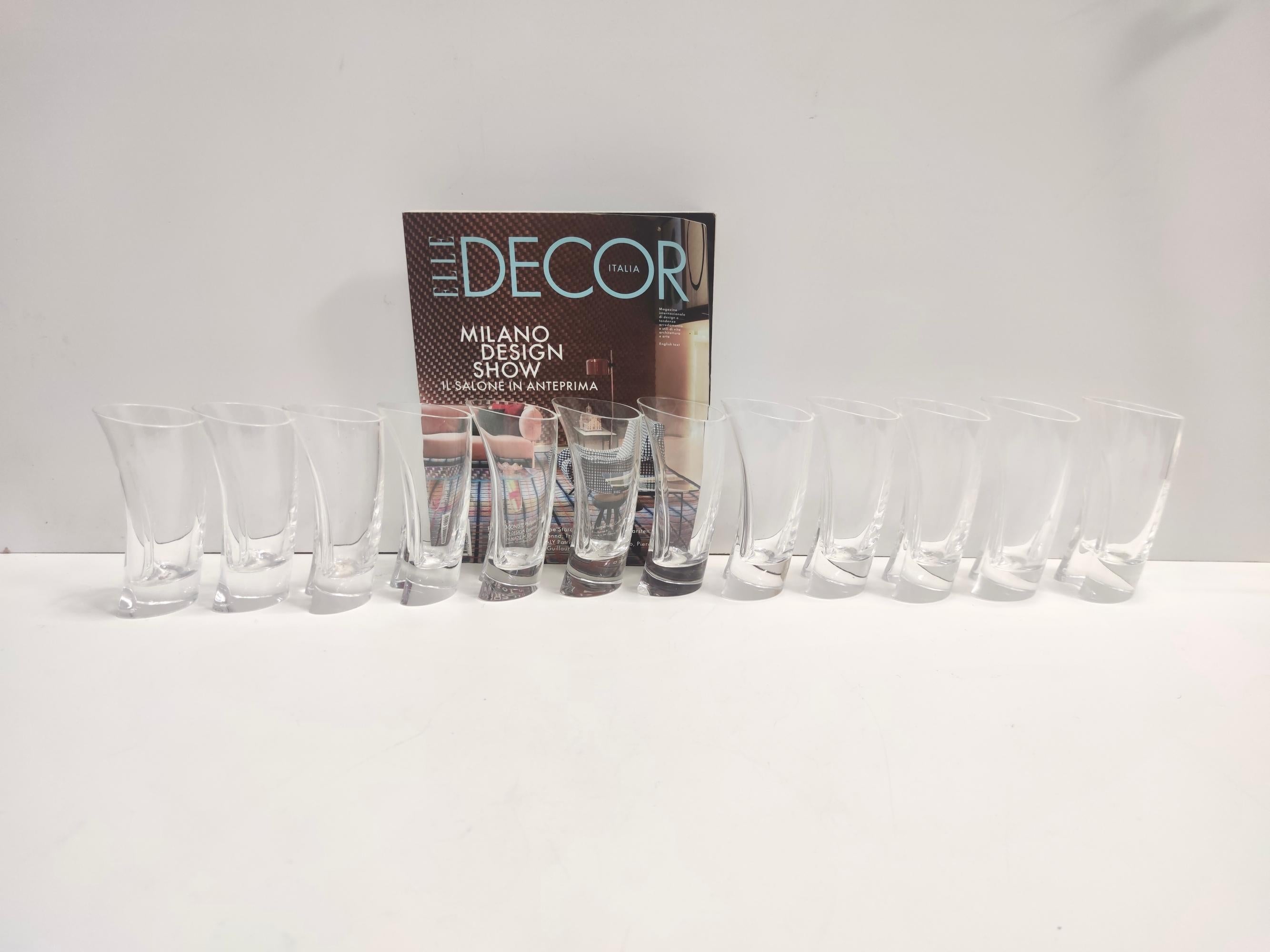 Made in Italy, 1970s. 
The drinking glasses are made in horseshoe-shaped glass. 
It is a vintage set, therefore it might show slight traces of use, but it can be considered as in excellent original condition and ready to become a piece in a