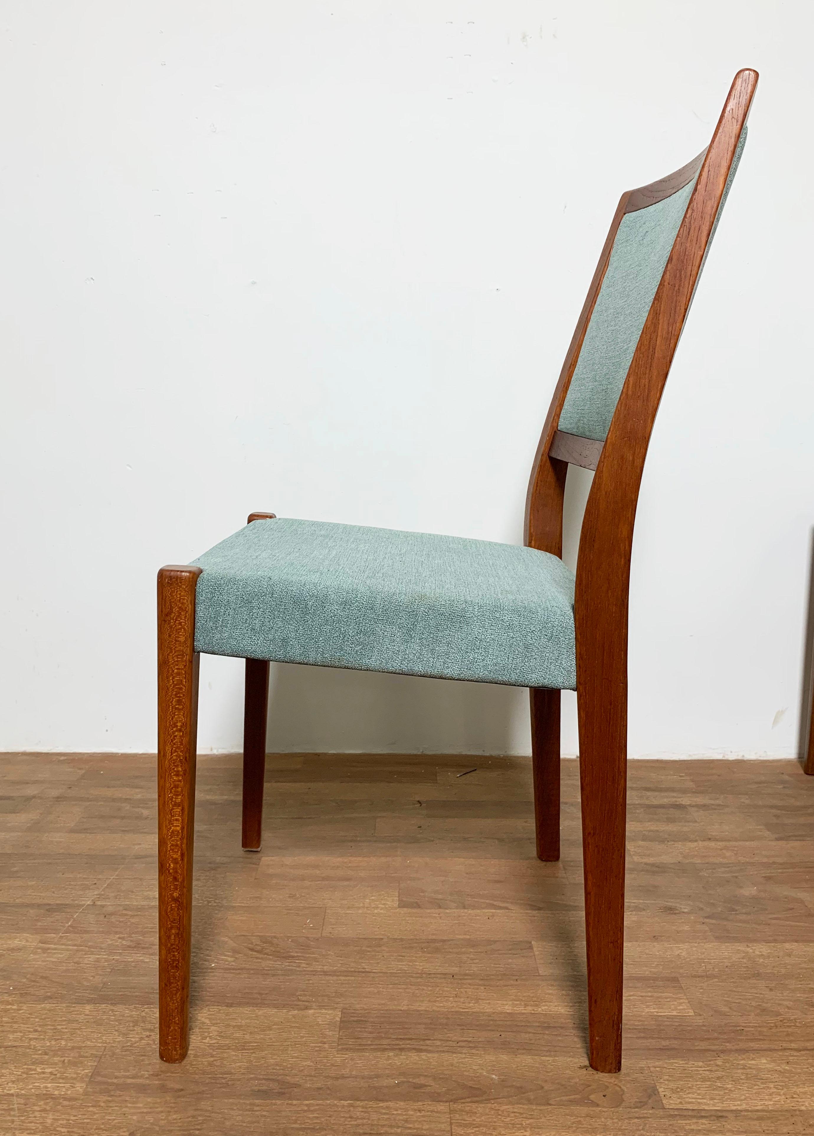 Set of twelve Scandinavian modern teak dining chairs by Svegards, made in Sweden, circa 1970s. Set consists of one arm chair and eleven side chairs.

Side chairs measure 18