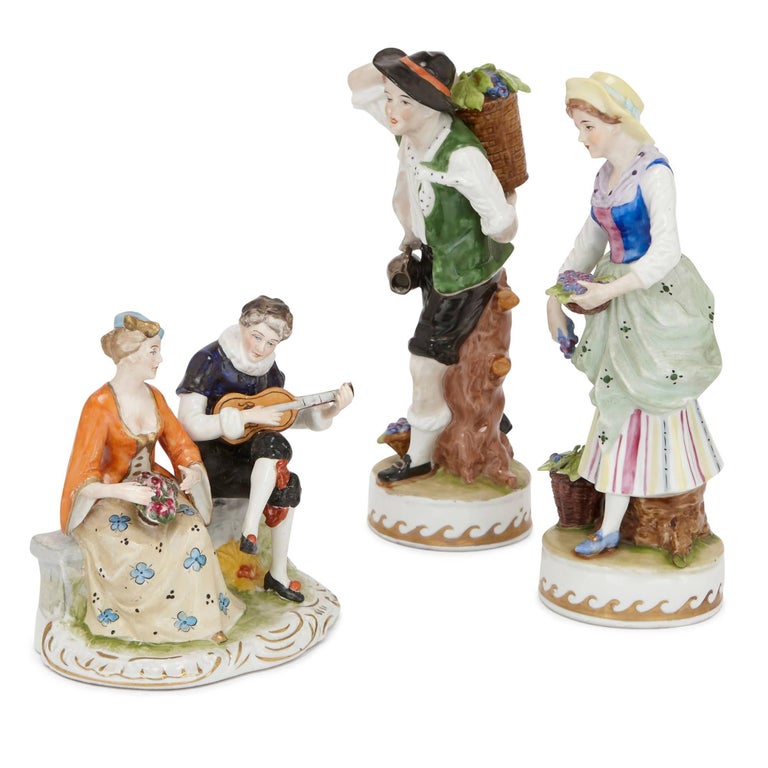 This charming set comprises twelve decorated figures and figural groups that one might encounter on a stroll through an 18th century town. The set includes animals, musicians, dancers, jesters and figures with fruit or flowers. The figures are all
