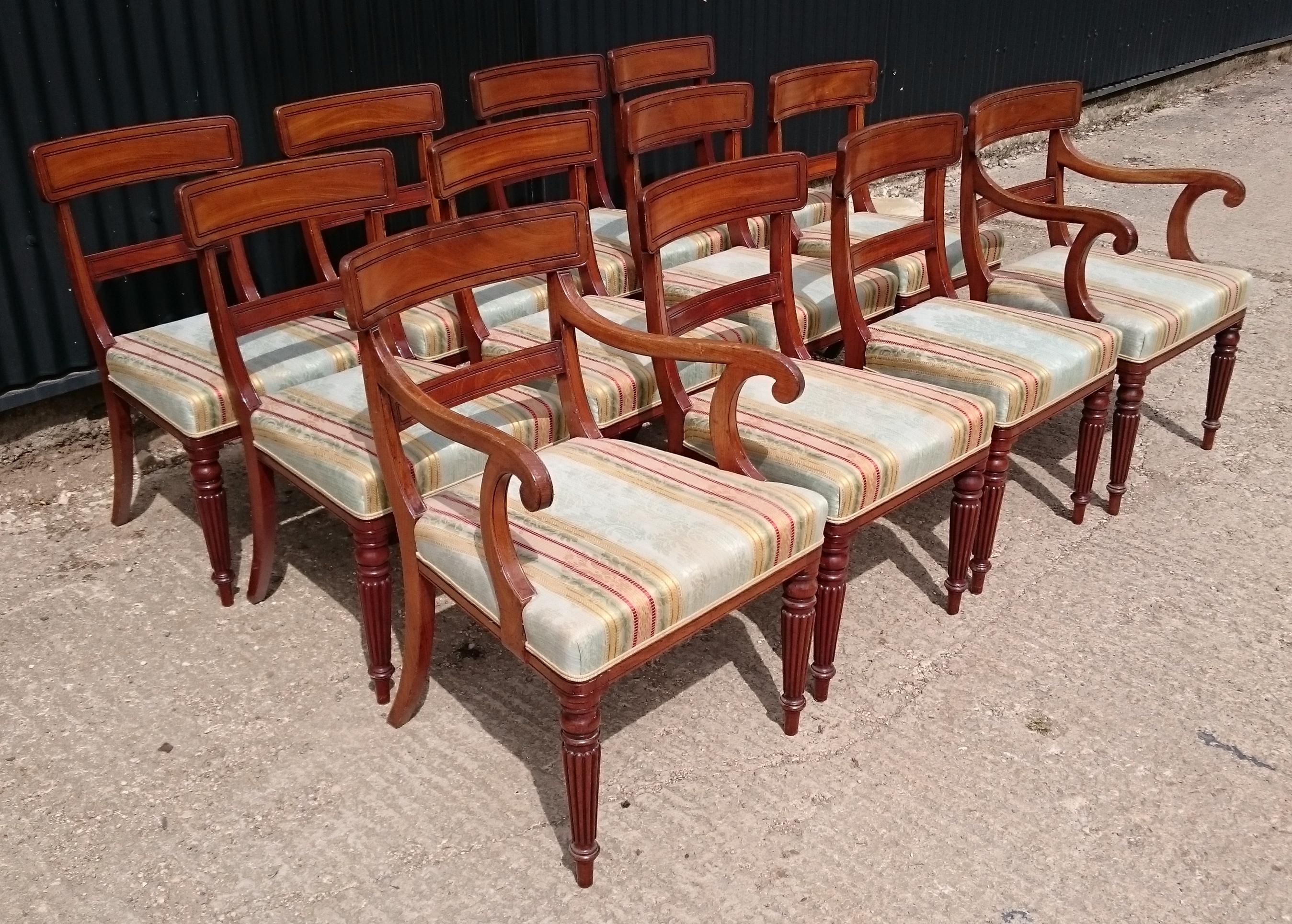 Very fine quality set of twelve Regency mahogany antique dining chairs. This set of chairs are generously proportioned for the period, the seats are deep and the back leg has a generous curve. The design of the leg and the design of the back splat