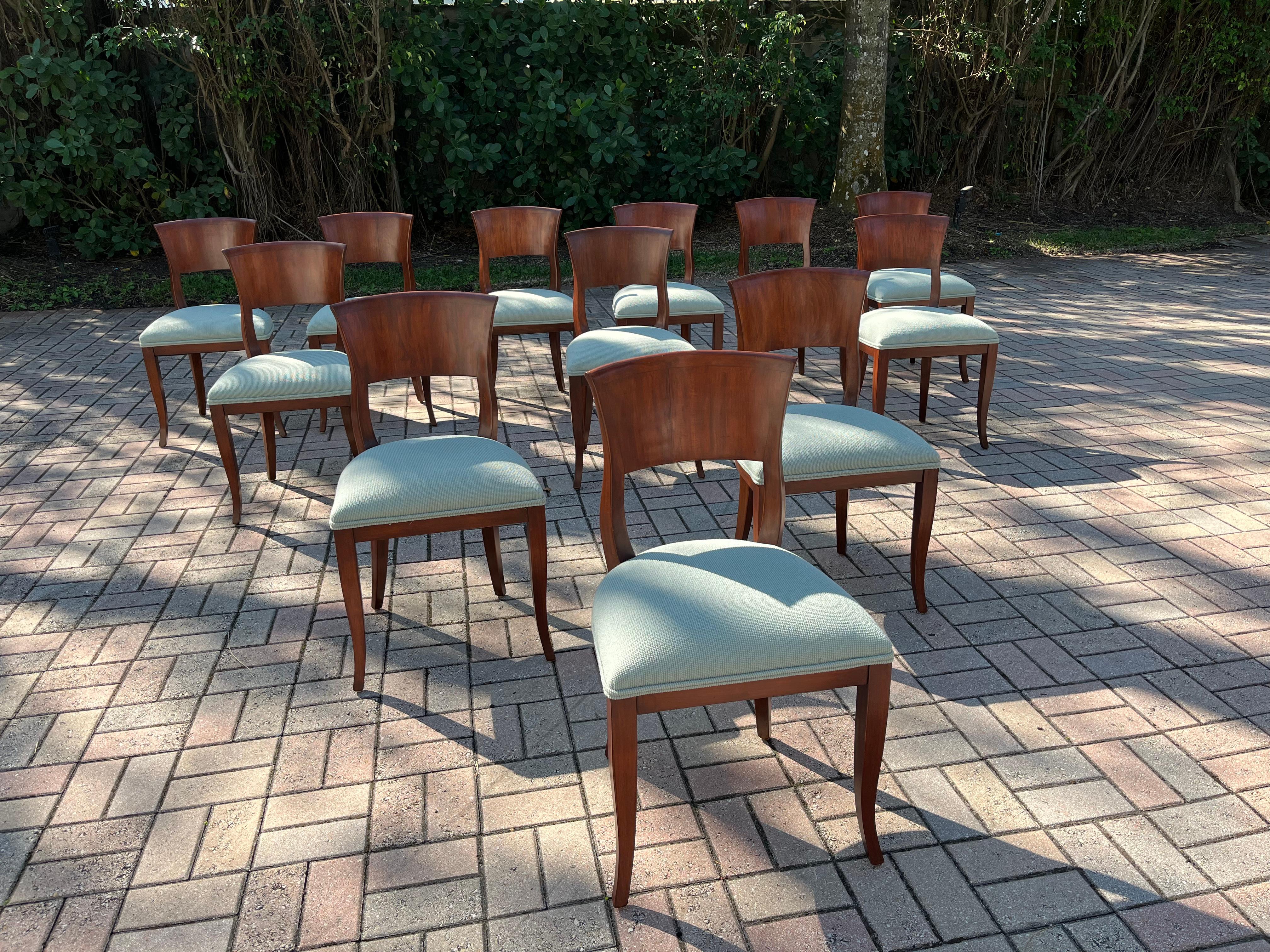 Set of twelve dining chairs, solid wood and fabric. Ready for a new home.