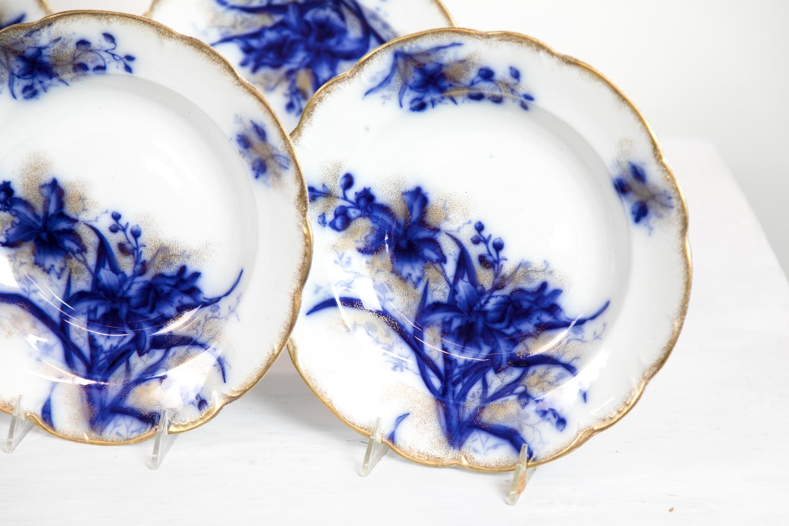 This set of flow blue plates is the orchid pattern by John Maddock and Sons of Burslem, England.
   