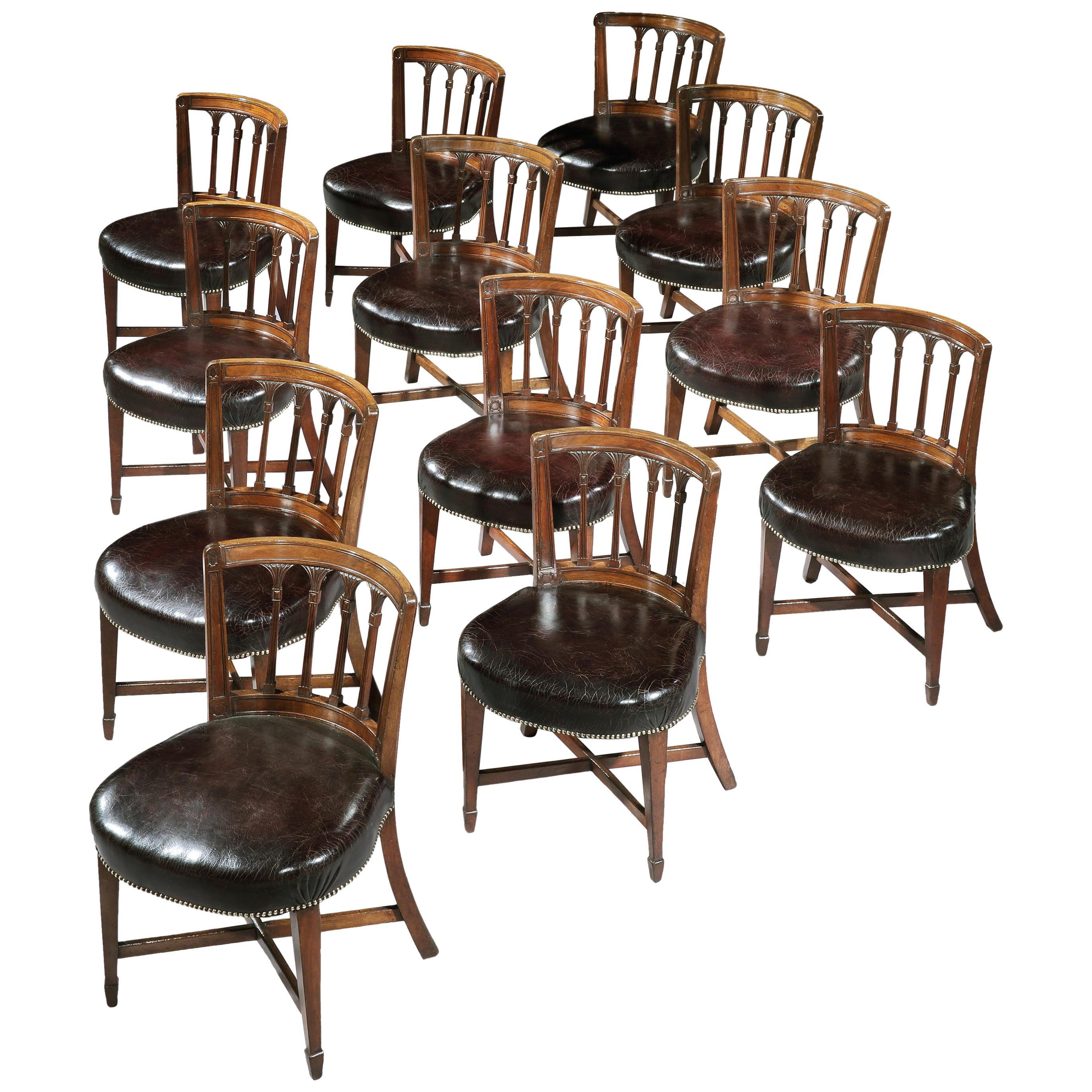 Set of Twelve English George III Brown Mahogany Library Chairs