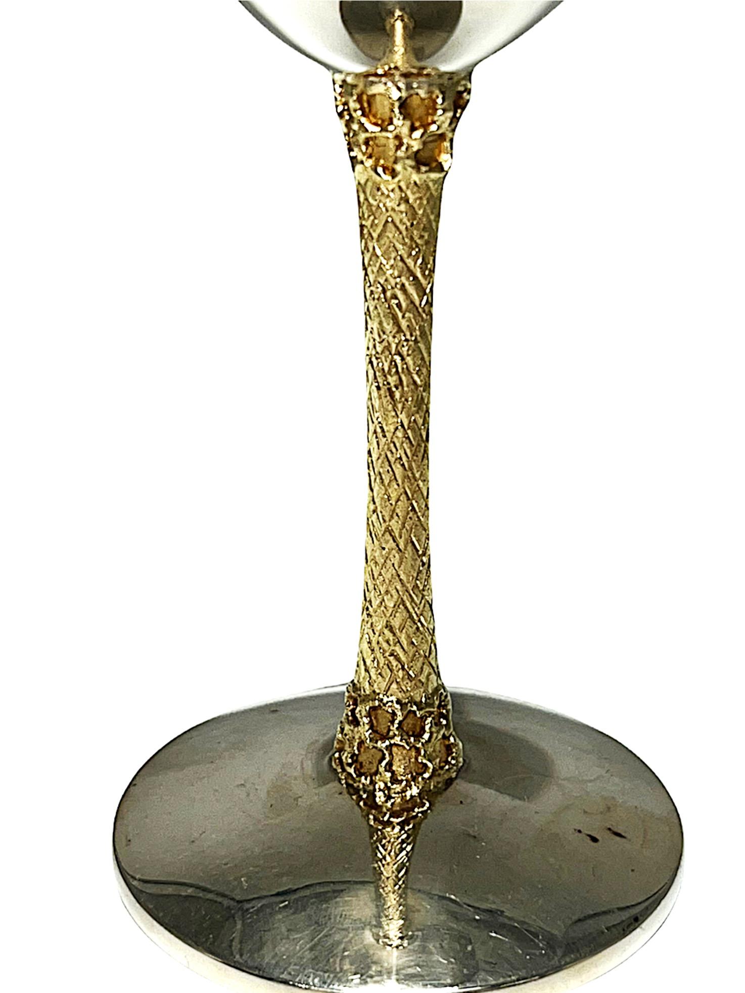 A set of twelve English parcel-gilt silver wine Globets by Devlin Staurt, London, 1970 / 1976. The taller are marked on rims of bowls, and the shorter are marked on bases. The six taller are designed with a gilt textured stems and bases, and the