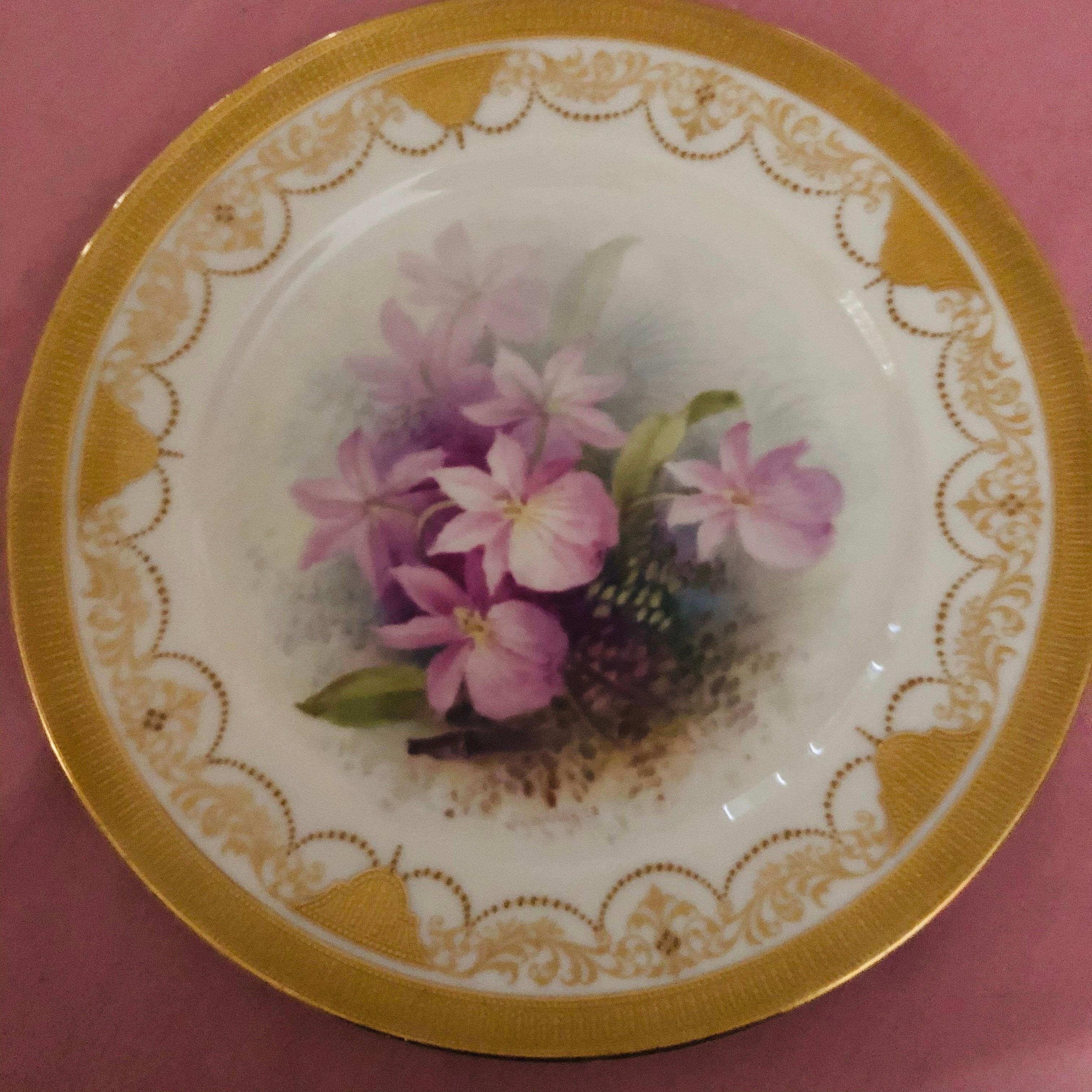 These are a set of 12 Lenox orchid plates from the 1920s. Each one is hand painted with a different orchid by W. H. Morley, who is a famous Lenox artist who specialized in painting flowers. These are museum quality paintings of orchids. There is a