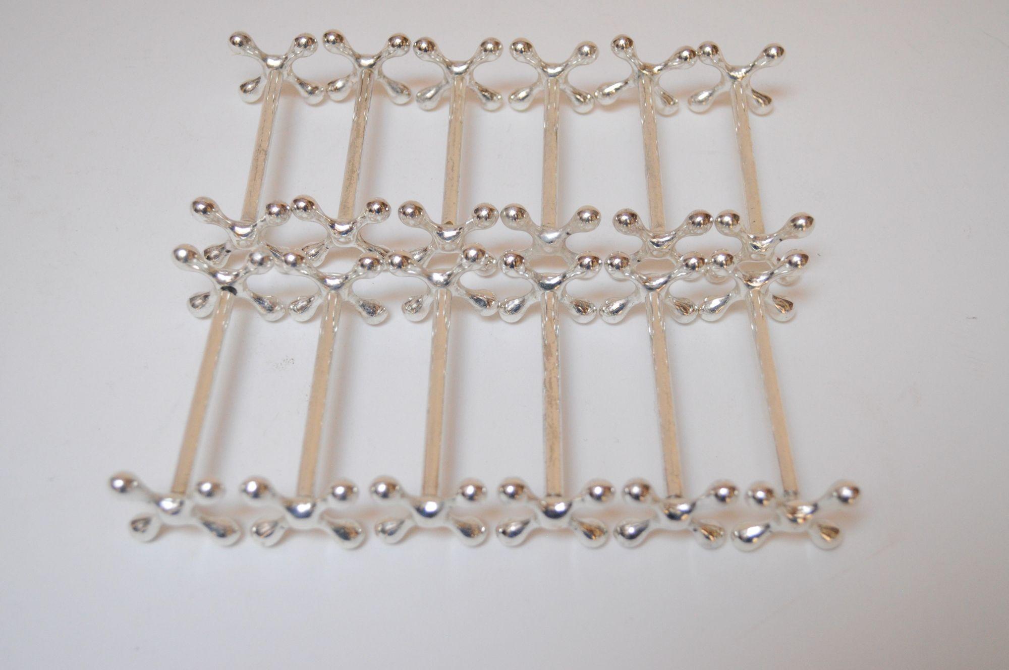Mid-20th Century Set of Twelve Italian Art Deco Jax / X Form Mitred Silver-Plated Knife Rests For Sale
