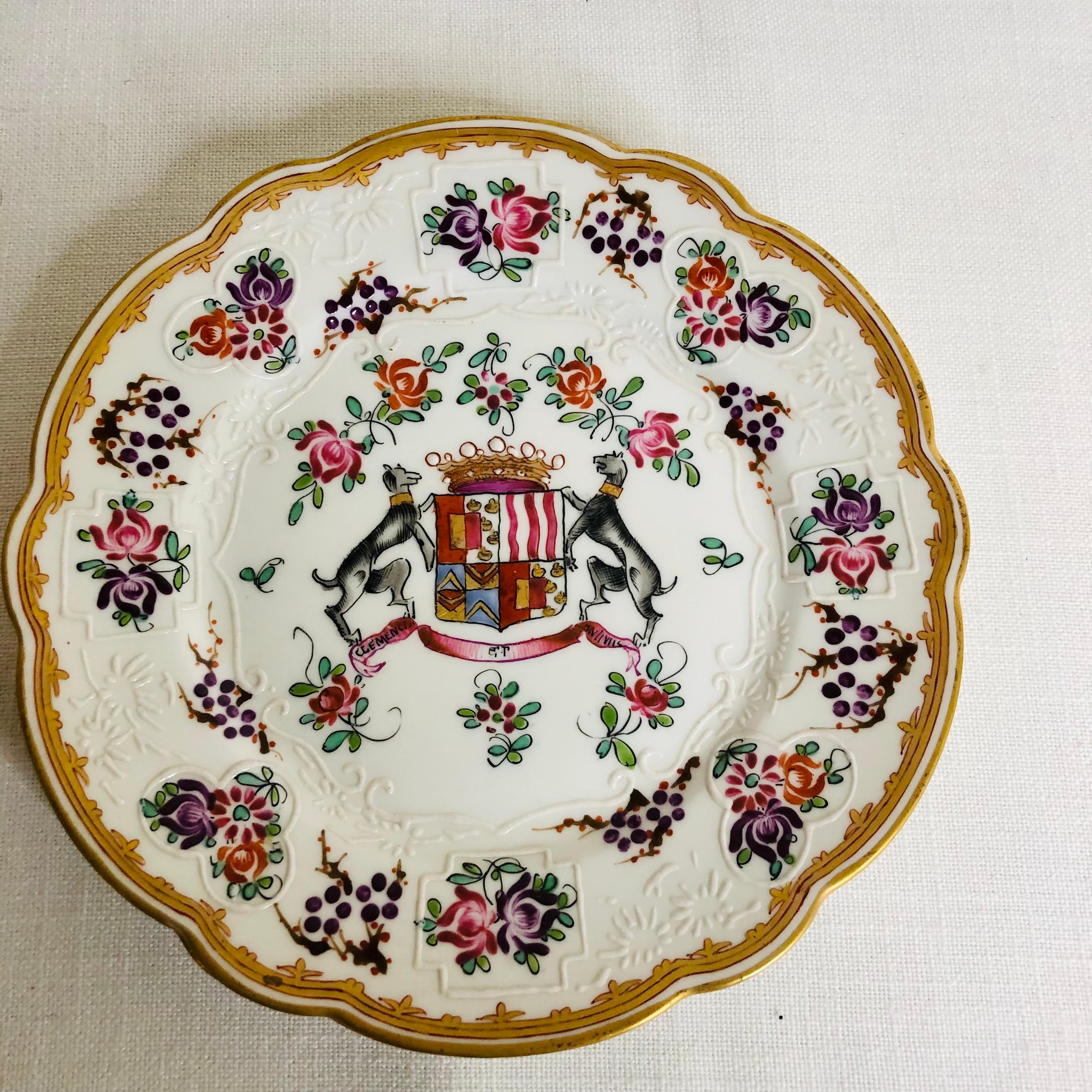 This is a charming set of twelve French Samson armorial dessert plates. Each are hand-painted with a coat of arms on a white ground. There are many different coats of arms on these plates. Some of the coat of arms are painted with lions, unicorns,