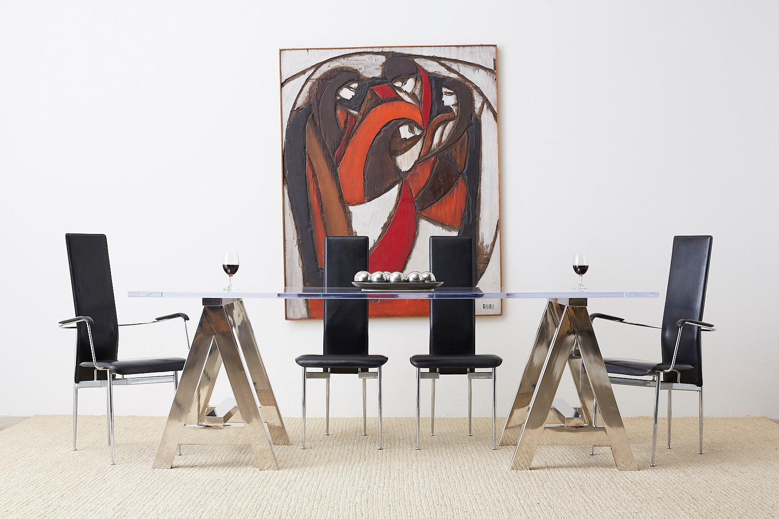 Chic set of 12 Postmodern Italian leather and chrome dining chairs. Designed by Giancarlo Vegni and Gianfranco Gualtierotti for Fasem International. Set consists of two armchairs and ten side chairs, the latter being 17.5