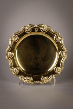 Juego de doce platos georgianos de plata dorada