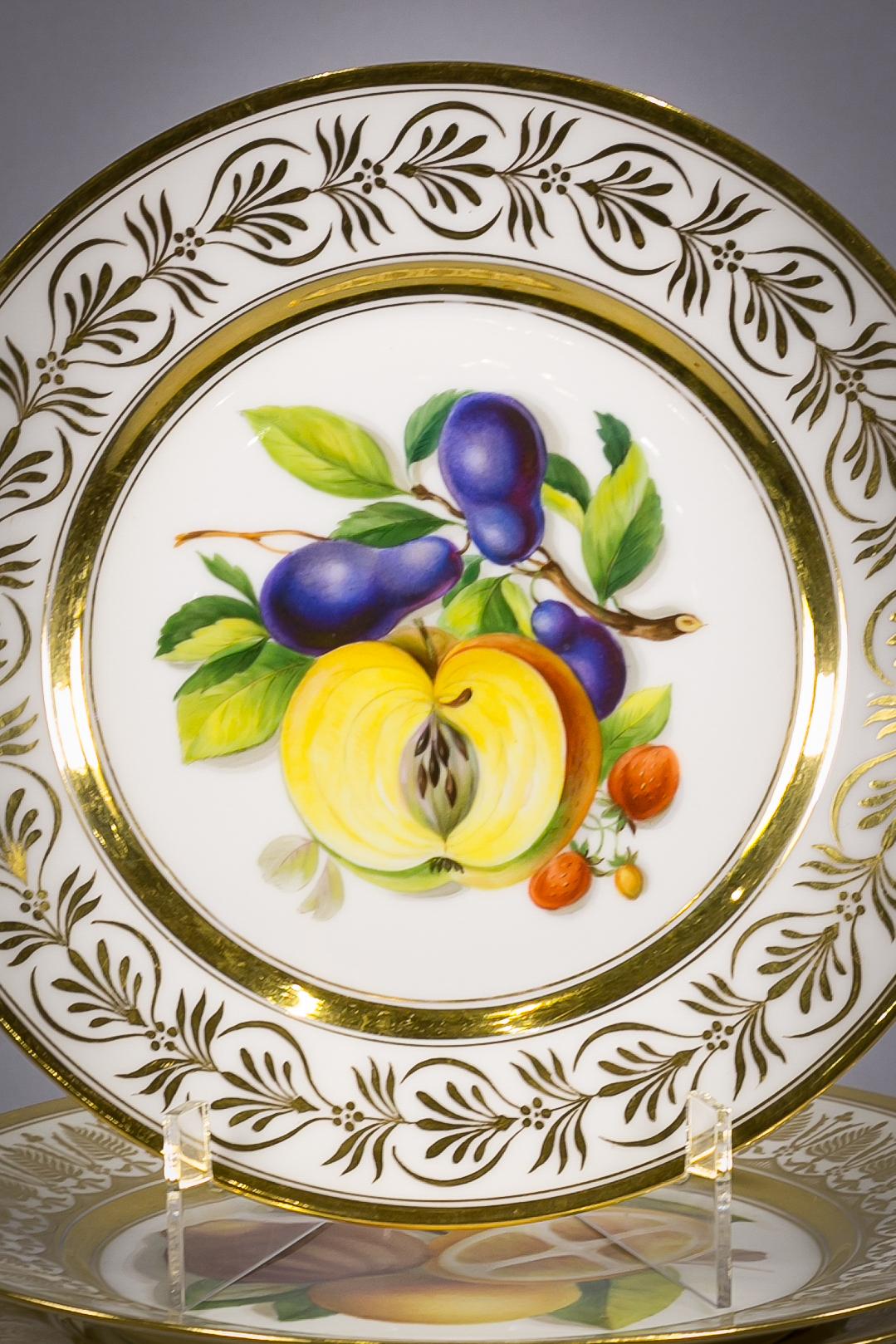 Pomological plates. Each painted with different arrangements of fruits with harlequin borders in gilt, circa 1900.