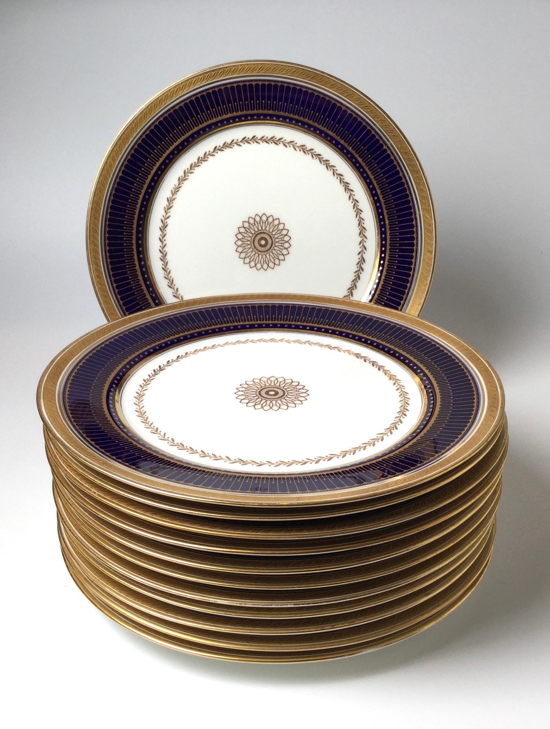 Set of twelve gold gilt and cobalt service plates BWM & Co for Gillman, NYC, the cobalt band highlighted by gold with a central starburst medallion.
In very good original condition, circa early 1900s.