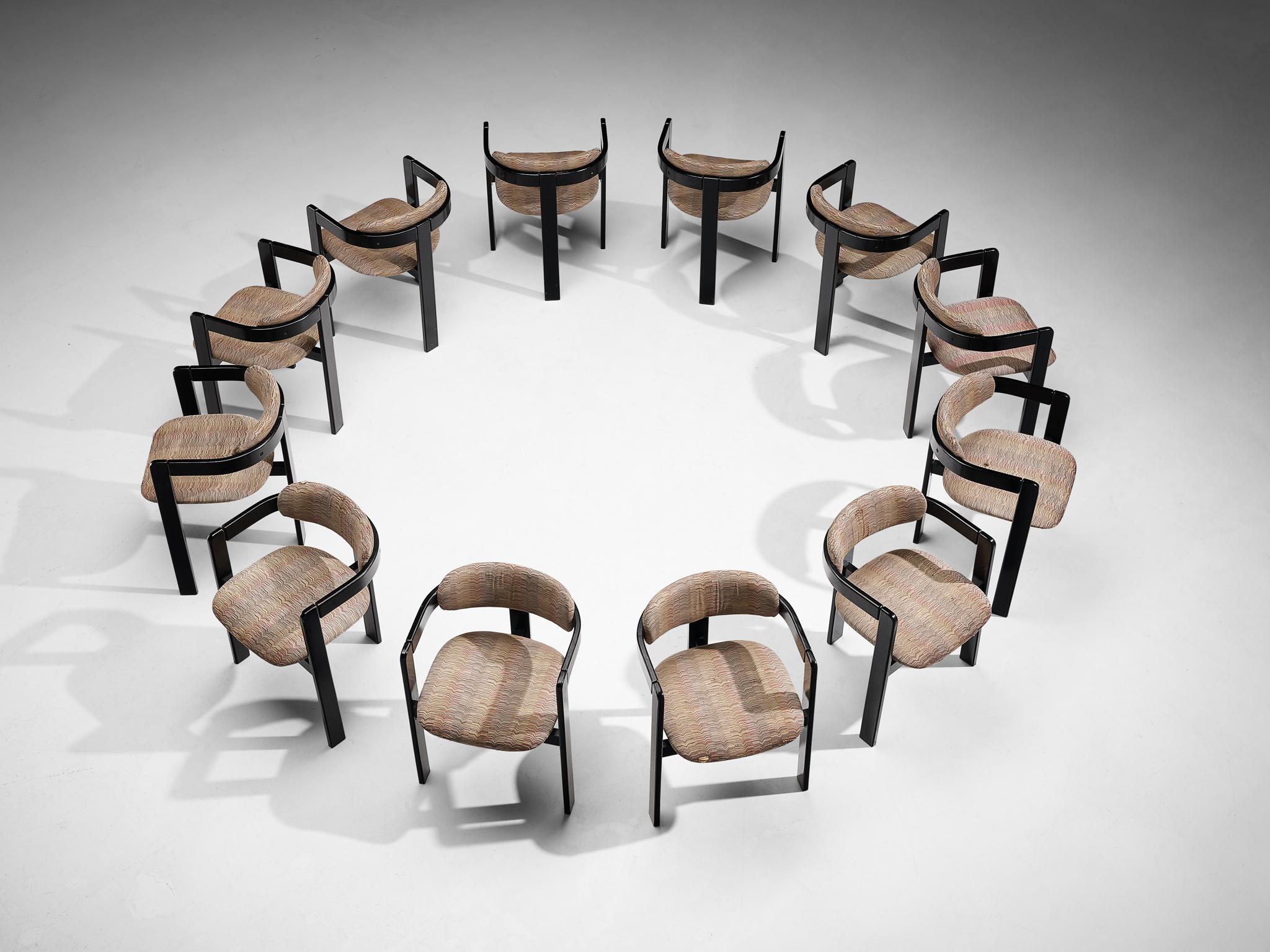Set of twelve dining chairs, wood, fabric, Italy, 1970s

This lovely set of Italian dining chair has a strong resemblance to Augusto Savini's 'Pamplona' chair (1965) and Afra & Tobia Scrapa's 'Pigreco' chair (1959/60), yet the designs are different