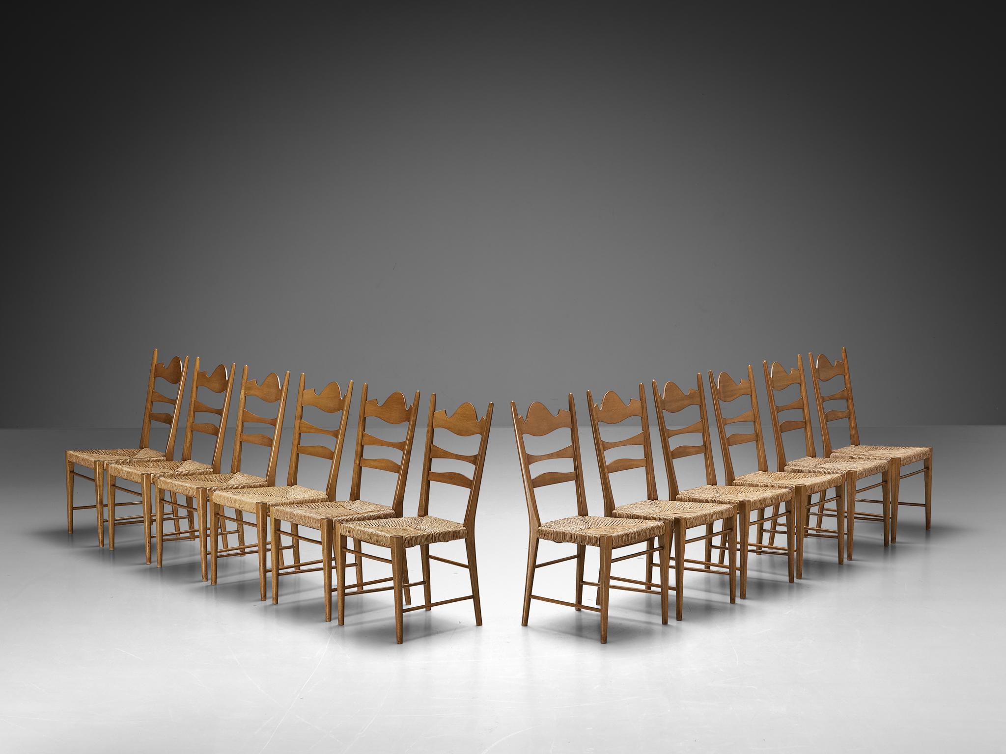 Set of twelve dining chairs, beech, straw, Italy, 1950s

Crafted with a refined decorative allure and a rustic inclination, these chairs present exquisite craftsmanship and intricate woodcarvings, showcasing a unique design. The backrest features