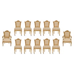 Set di dodici sedie da pranzo italiane del primo Ottocento in stile Luigi XVI in legno dorato