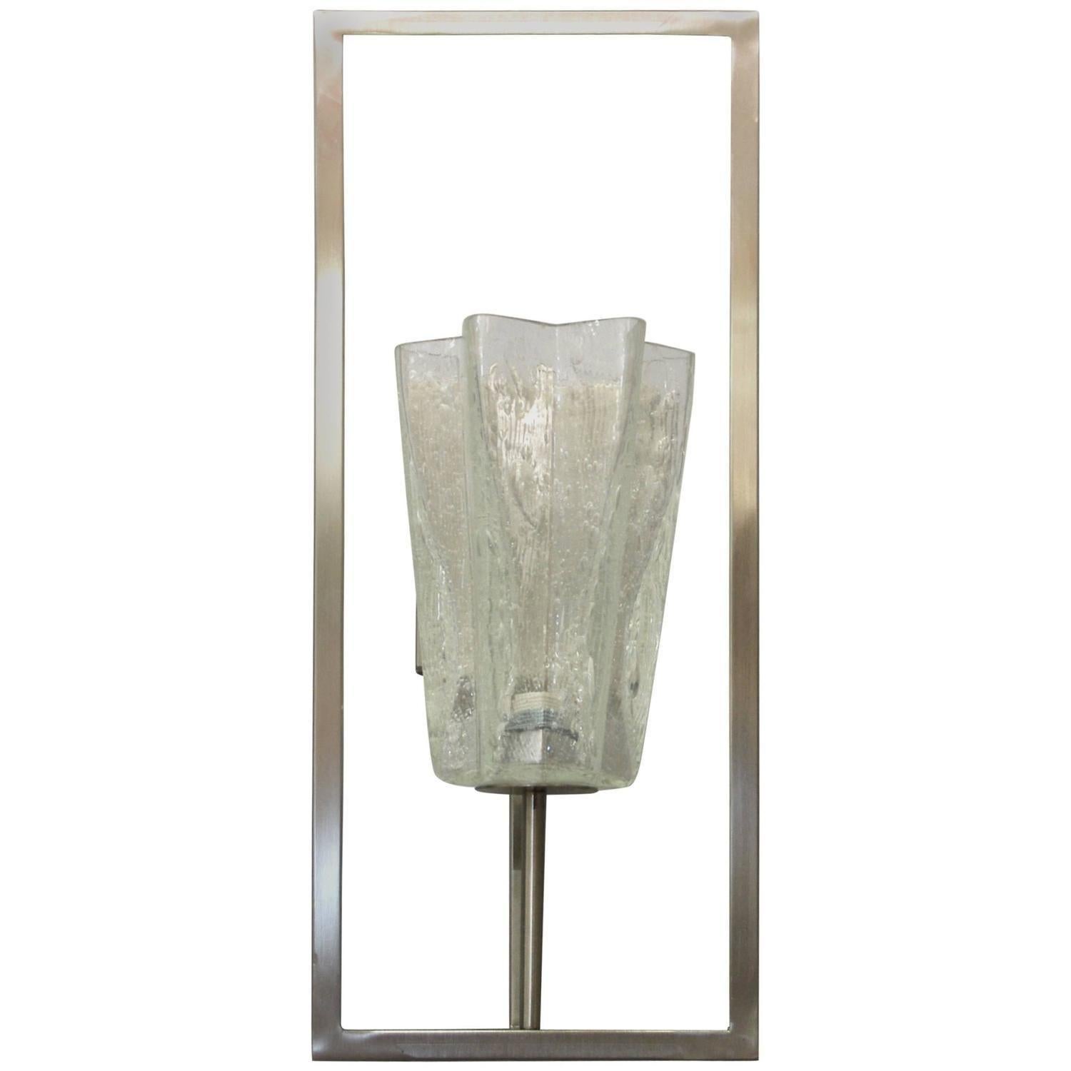 Set of Twelve Limited Edition Italian sconce with clear textured Murano glasses hand blown to the shape of a star and mounted on rectangular brushed nickel structures, made in Italy.