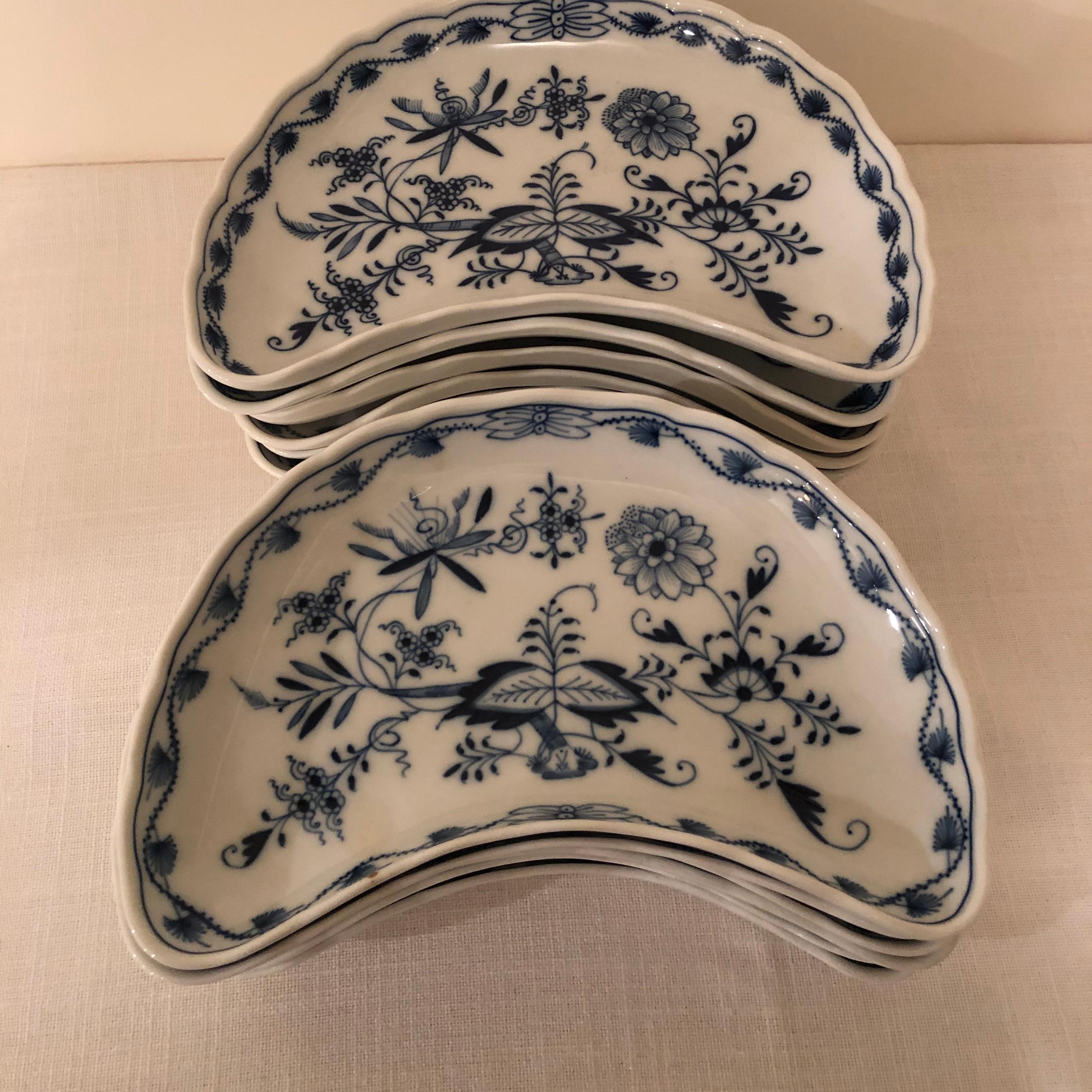 I would like to offer you this rare set of twelve blue onion Meissen large crescent shape dishes. This shaped dish was originally used to put along the side of your dinner plates to collect your bones. That is why they were originally called bone