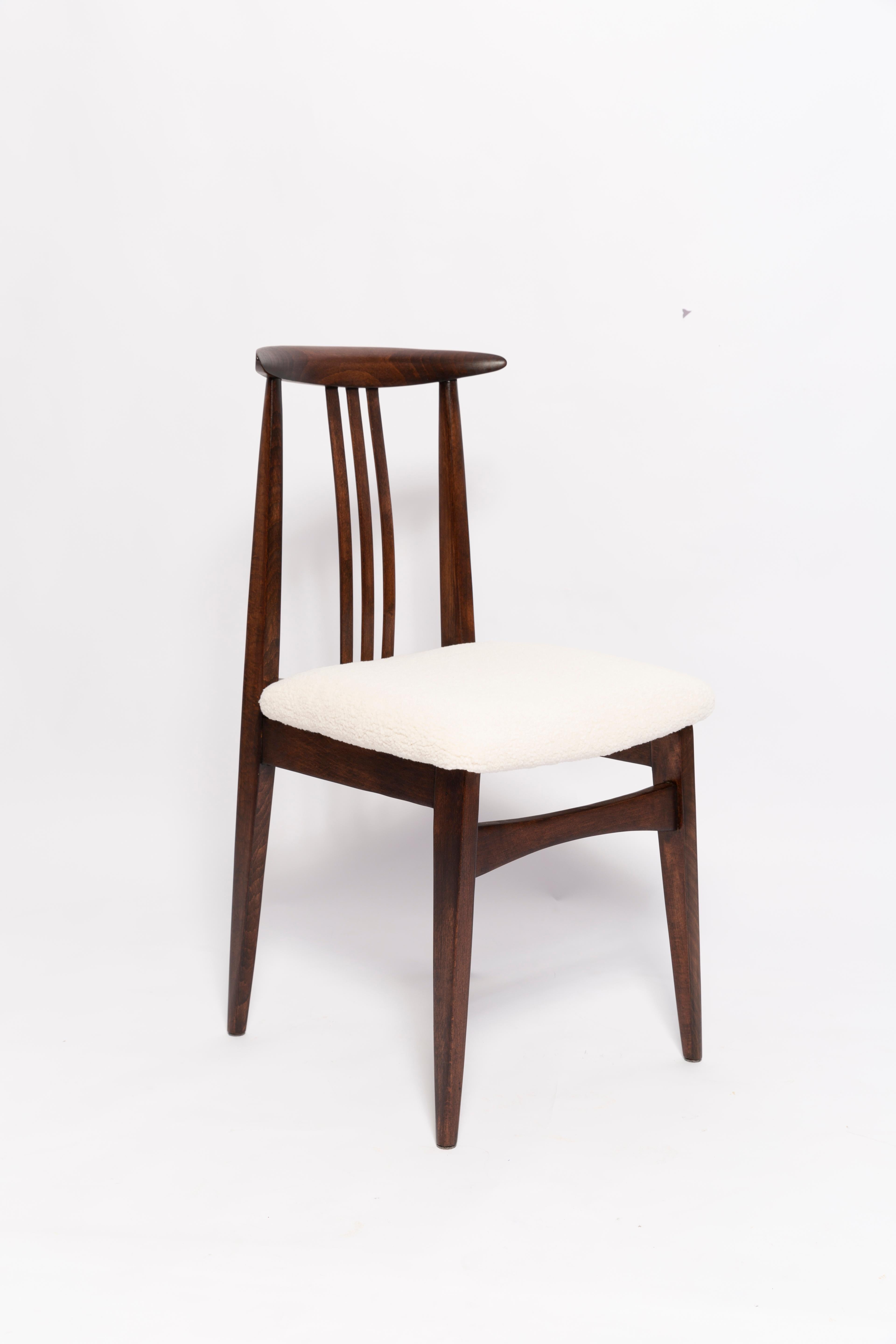 A beautiful beech chair designed by M. Zielinski, type 200 / 100B. Manufactured by the Opole Furniture Industry Center at the end of the 1960s in Poland. The chair is after undergone a complete carpentry and upholstery renovation. Seats covered with