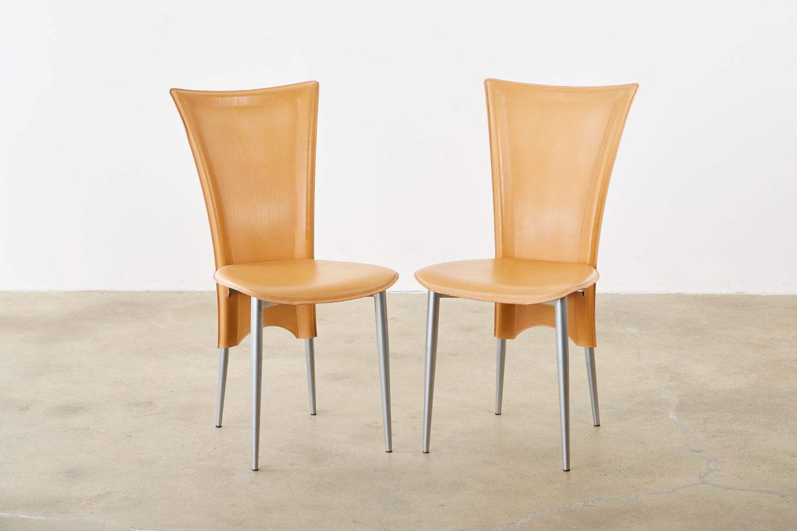 Distinctive set of twelve Italian dining chairs featuring a camel colored leather wrapped frame. Amazingly comfortable with an ergonomic design made in the modern style. Thick leather formed surfaces bordered with light stitches. Each metal frame