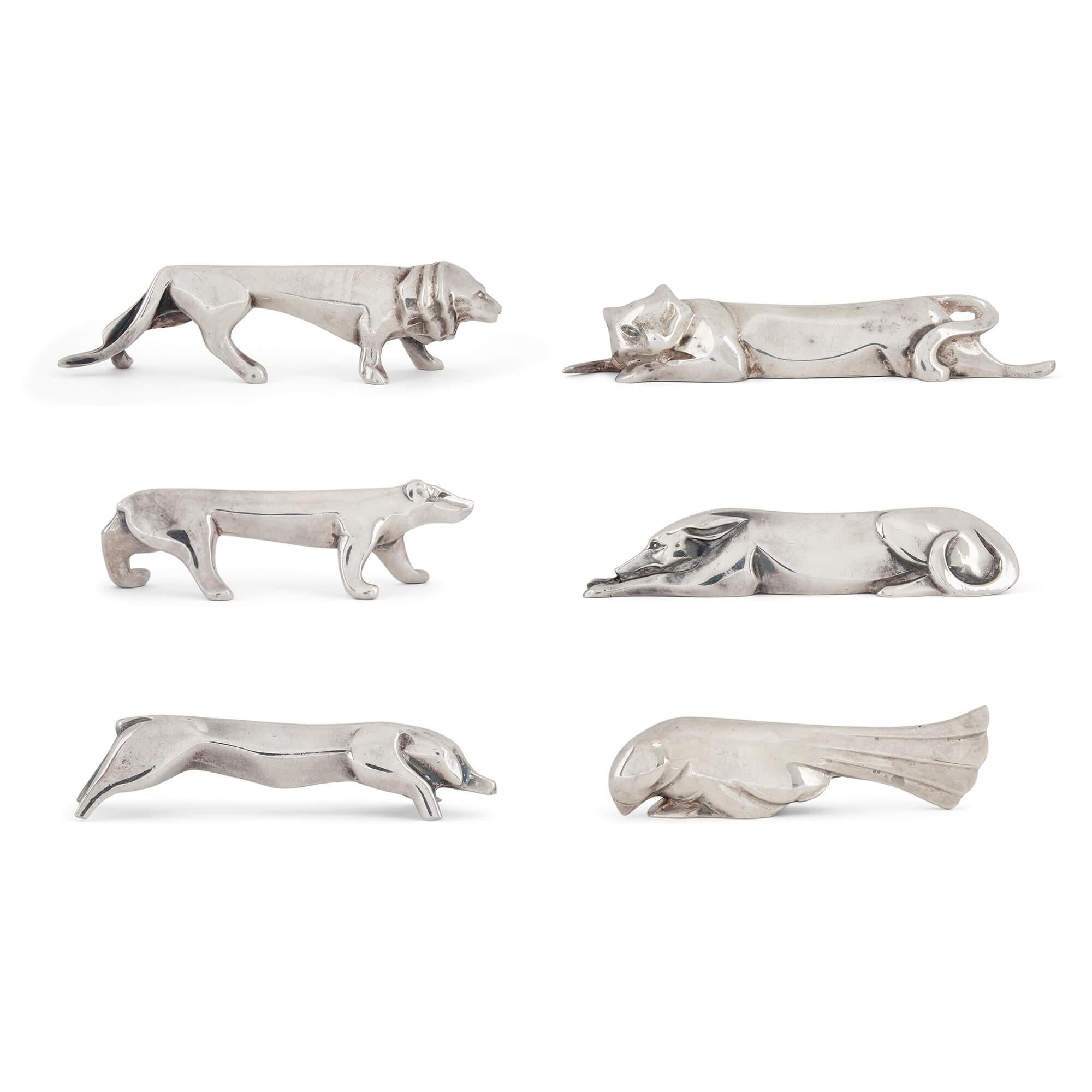 Set of twelve plated silver animalier knife rests by Christofle
French, c. 1930
Bird: height 2cm, width 8cm, depth 2cm
Case: height 4.5cm, width 28cm, depth 32cm

This charming set of knife rests was designed by the Swiss artist Edouard Sandoz