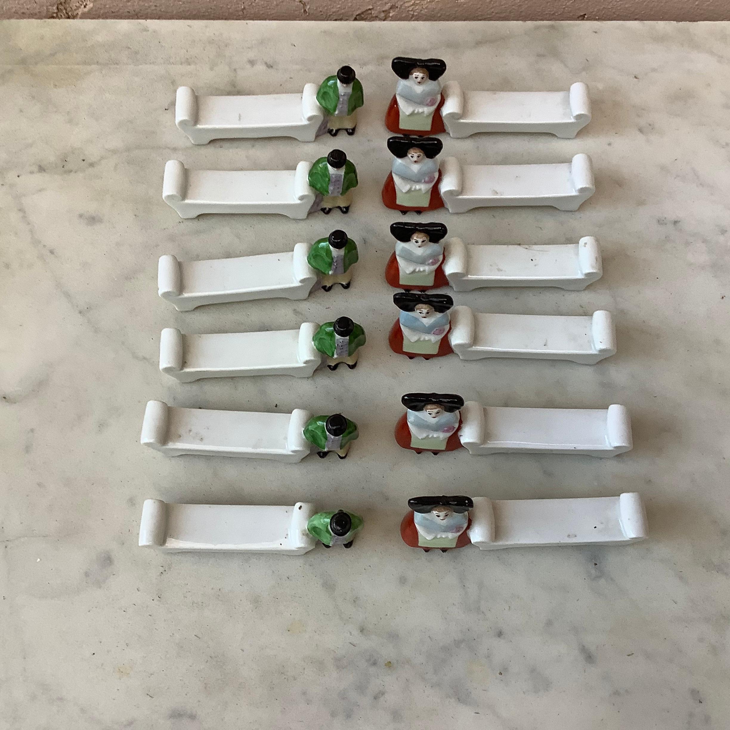 Rare French set of twelve Porcelain Alsaciens knife rests circa 1920.
They wear the traditional costume of Alsace in East of France.  
  