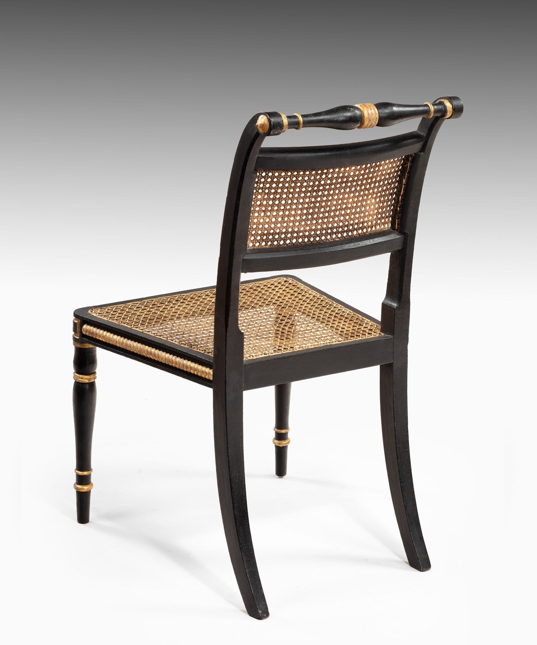 Set of Twelve Regency Dining Chairs in Ebonized and Gilded Decoration 1