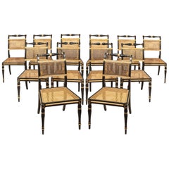 Set of Twelve Regency Dining Chairs in Ebonized and Gilded Decoration