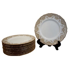 Set of Twelve Royal Doulton Dinner Plates with Raised Gold Arabesque Decoration