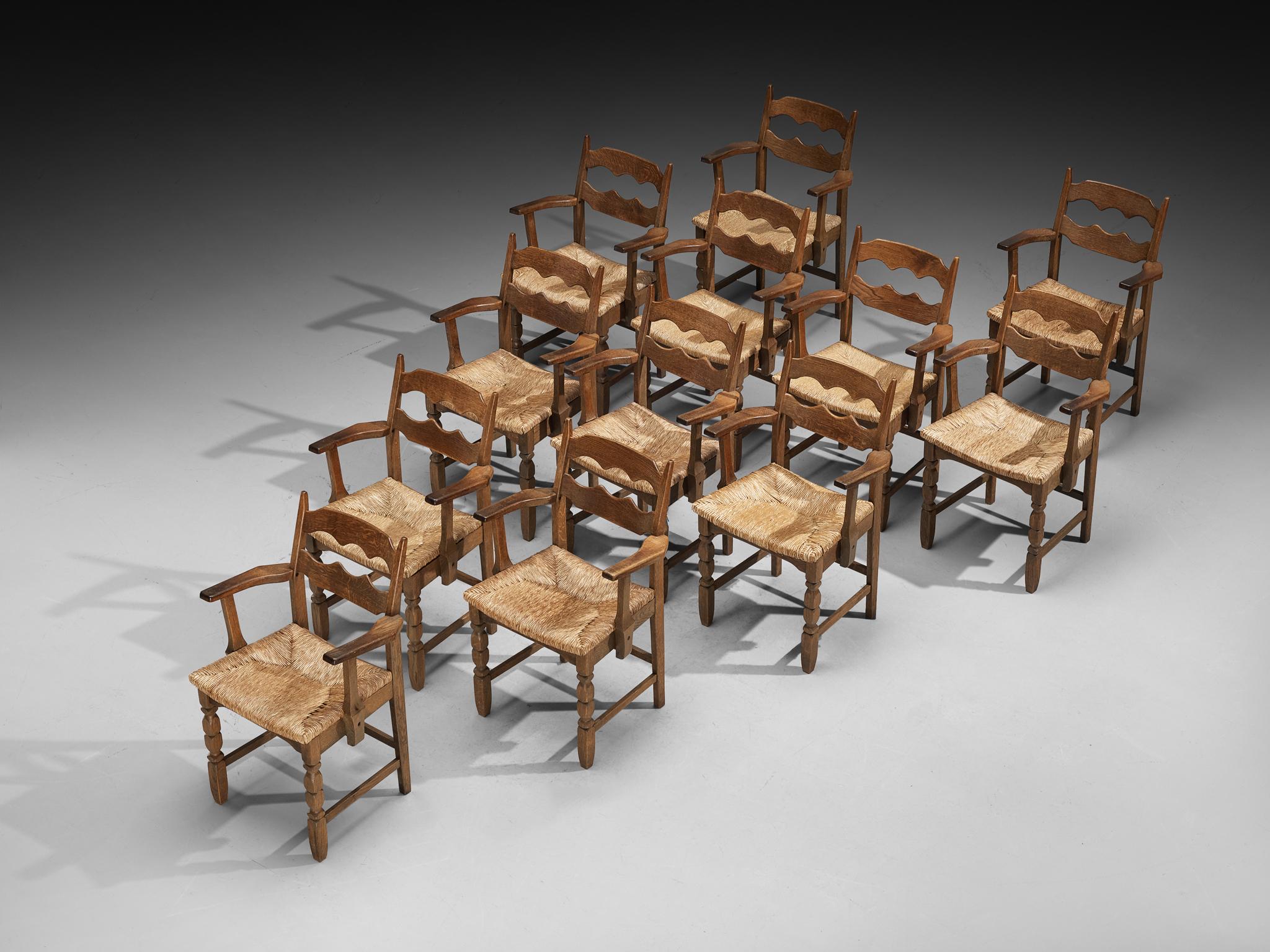 Set of Twelve Rustic Mid-Century Carved Armchairs in Oak and Straw In Good Condition For Sale In Waalwijk, NL