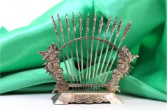 Set of twelve silver appetizer forks on a display stand with two dragons