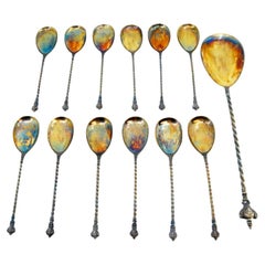 Set of twelve silver ice cream scoops
ladle w/ twisted handles
appliqués