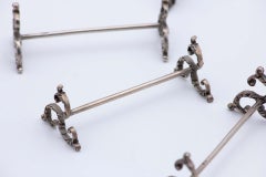 Jeu de douze porte-couteaux en argent