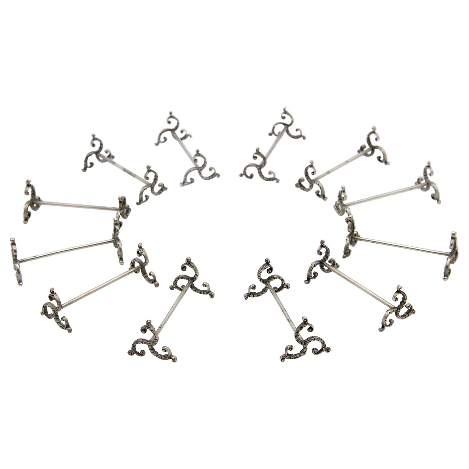 Set of twelve silver knife rests