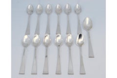 Set of twelve silver teaspoons and sugar scoops with pearl handles