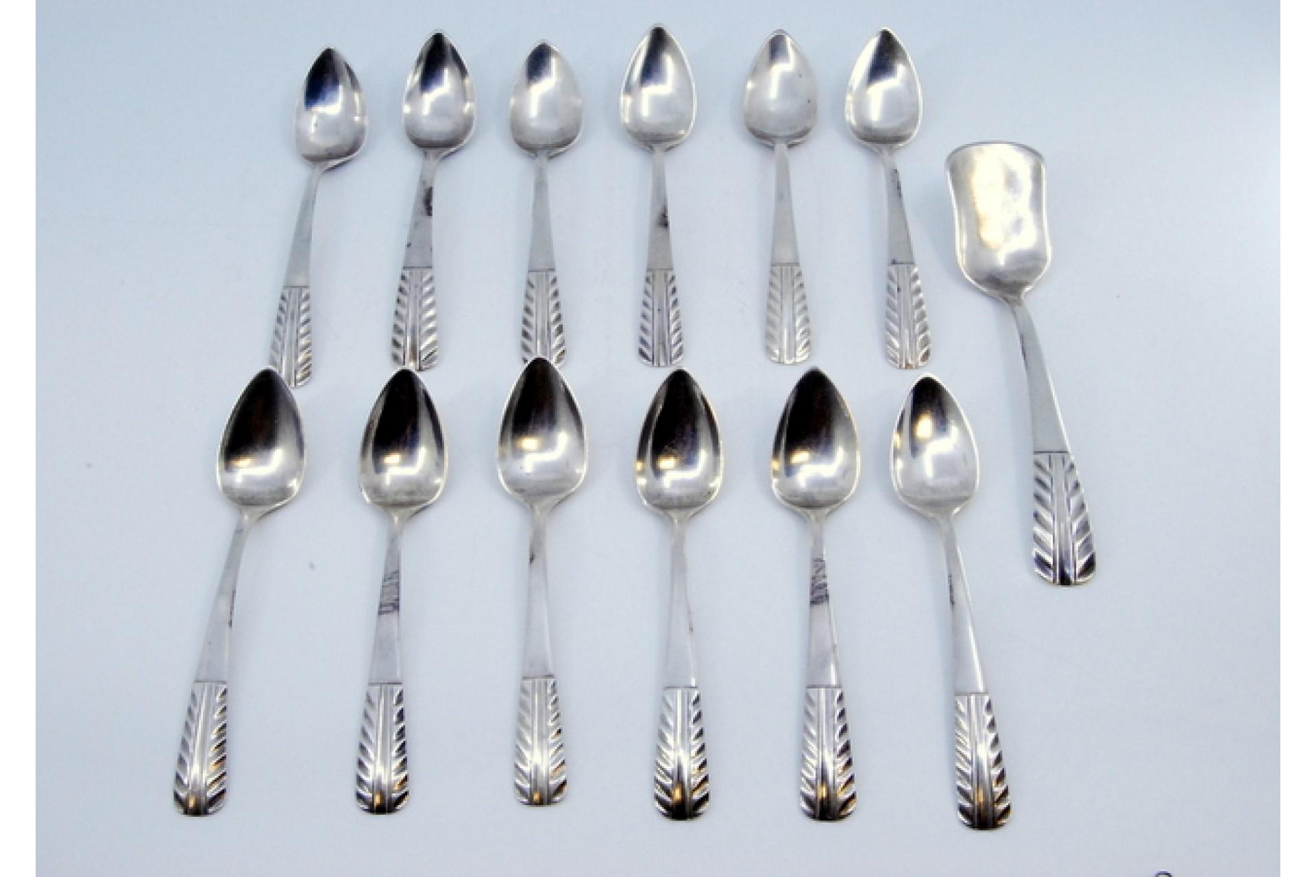 Description: Set of twelve silver teaspoons and sugar shovel with raised handles. Metal: Silver. Origin: Portuguese. Brand: javali II Title. Weight: 261.78 grams (Set of twelve spoons and shovel). Dimensions: Shovel - 14x3.1cm Spoon - 12x2.5cm.