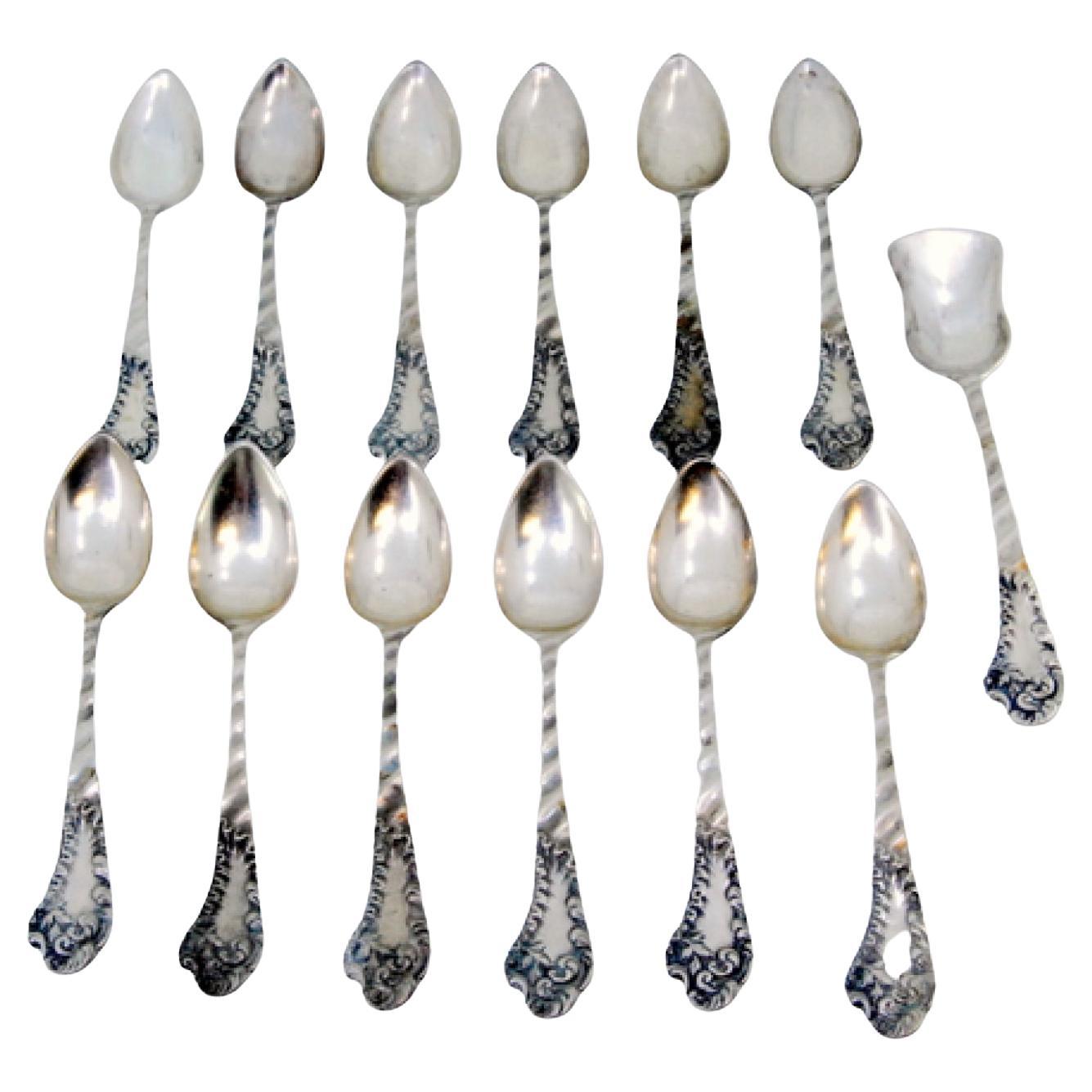 Set of twelve silver teaspoons
sugar scoop w/ wavy handles
monogram cards